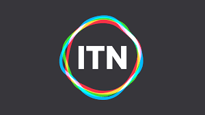 ITN logo with colorful ring around white text on black background.