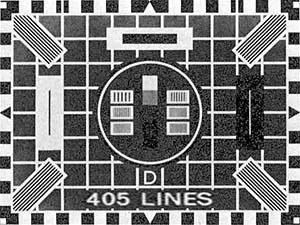 A black and white test pattern featuring a grid background, four corner markers resembling equal signs, a central circle with vertical and horizontal lines, and the text '405 LINES' at the bottom.