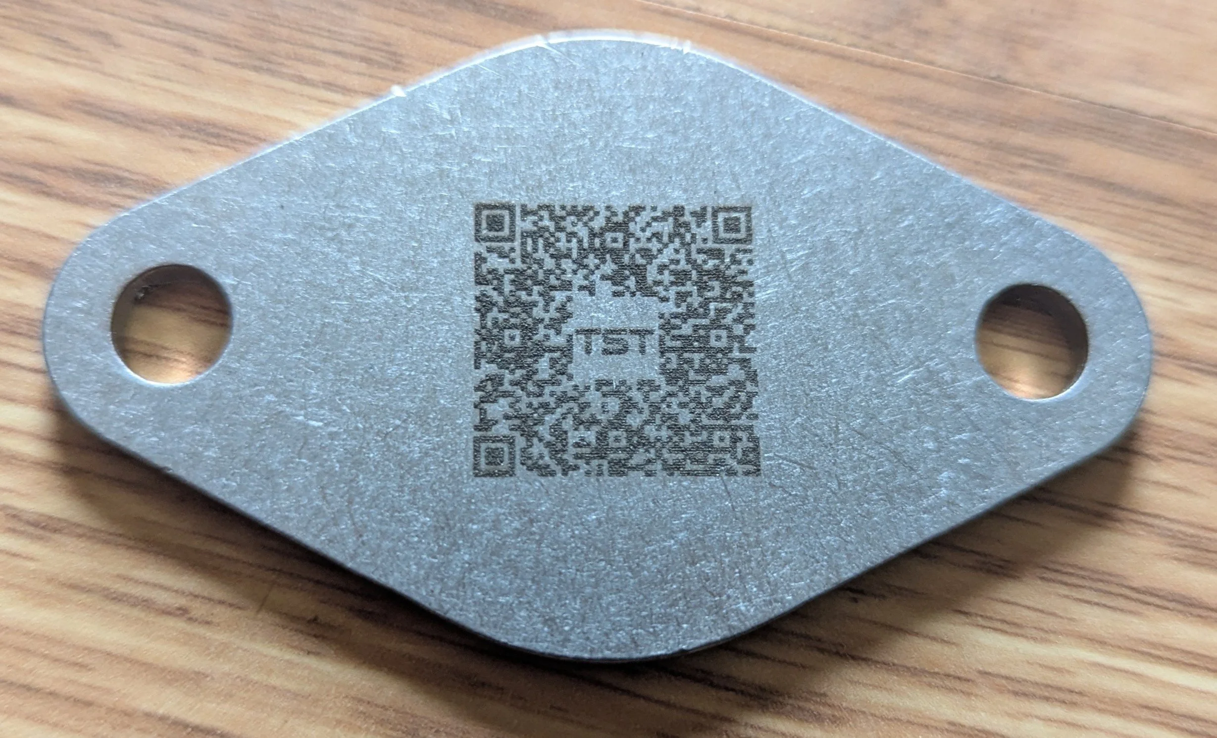 NOTE: The QR code for the install guide faces towards the exhaust and will not be visible after the installation.