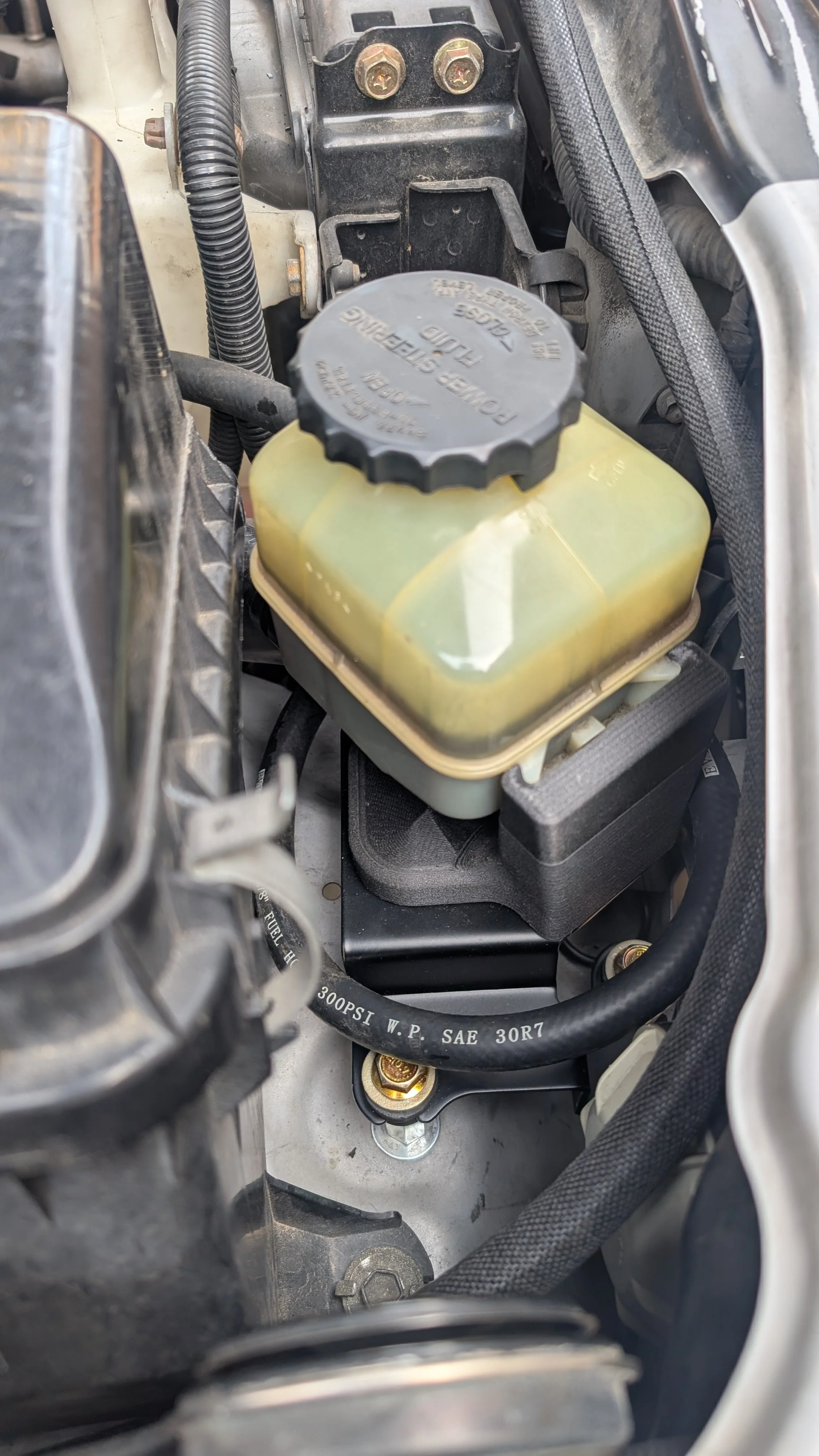 LX470 Power steering relocation bracket