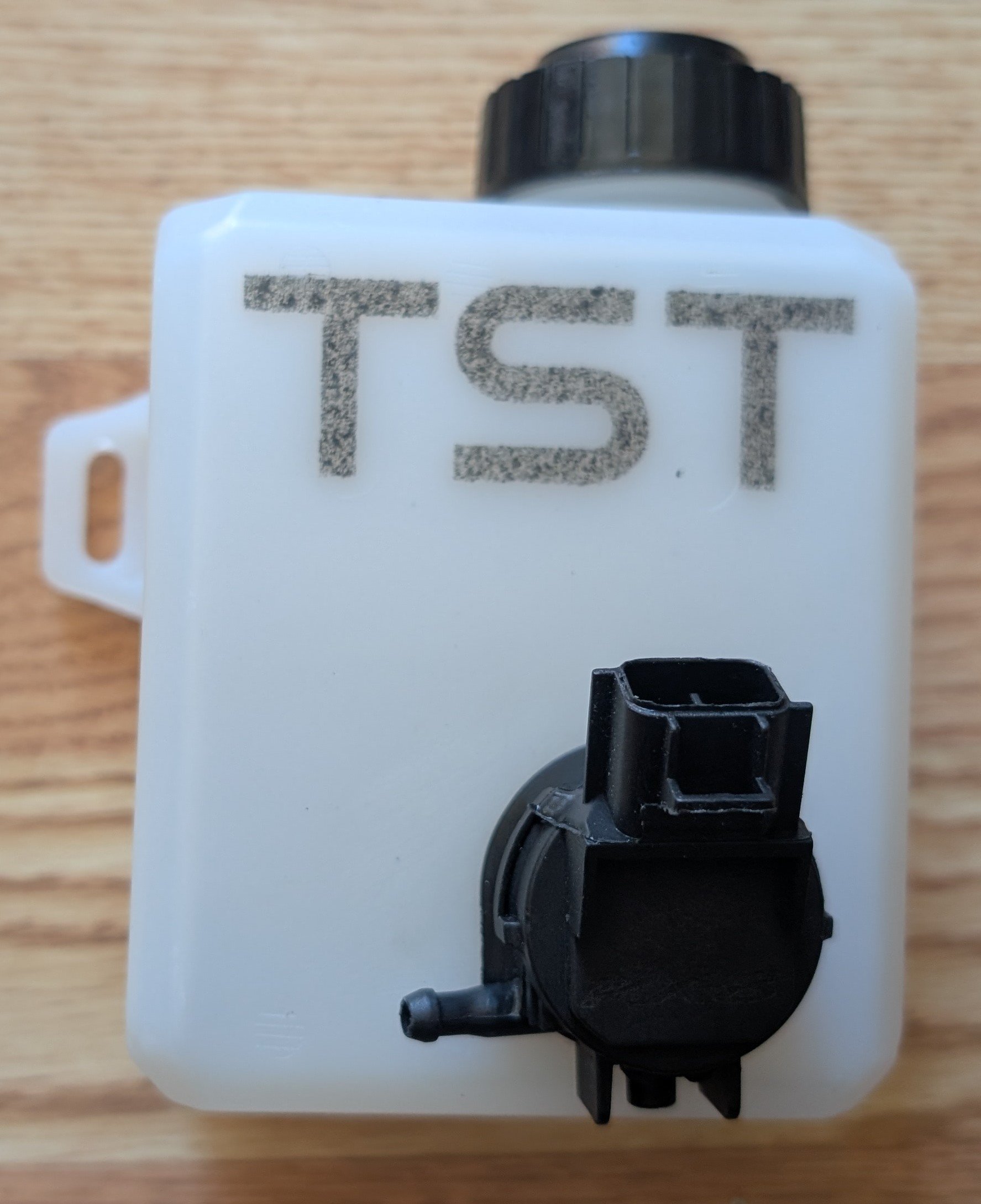 Washer tank with pump installed