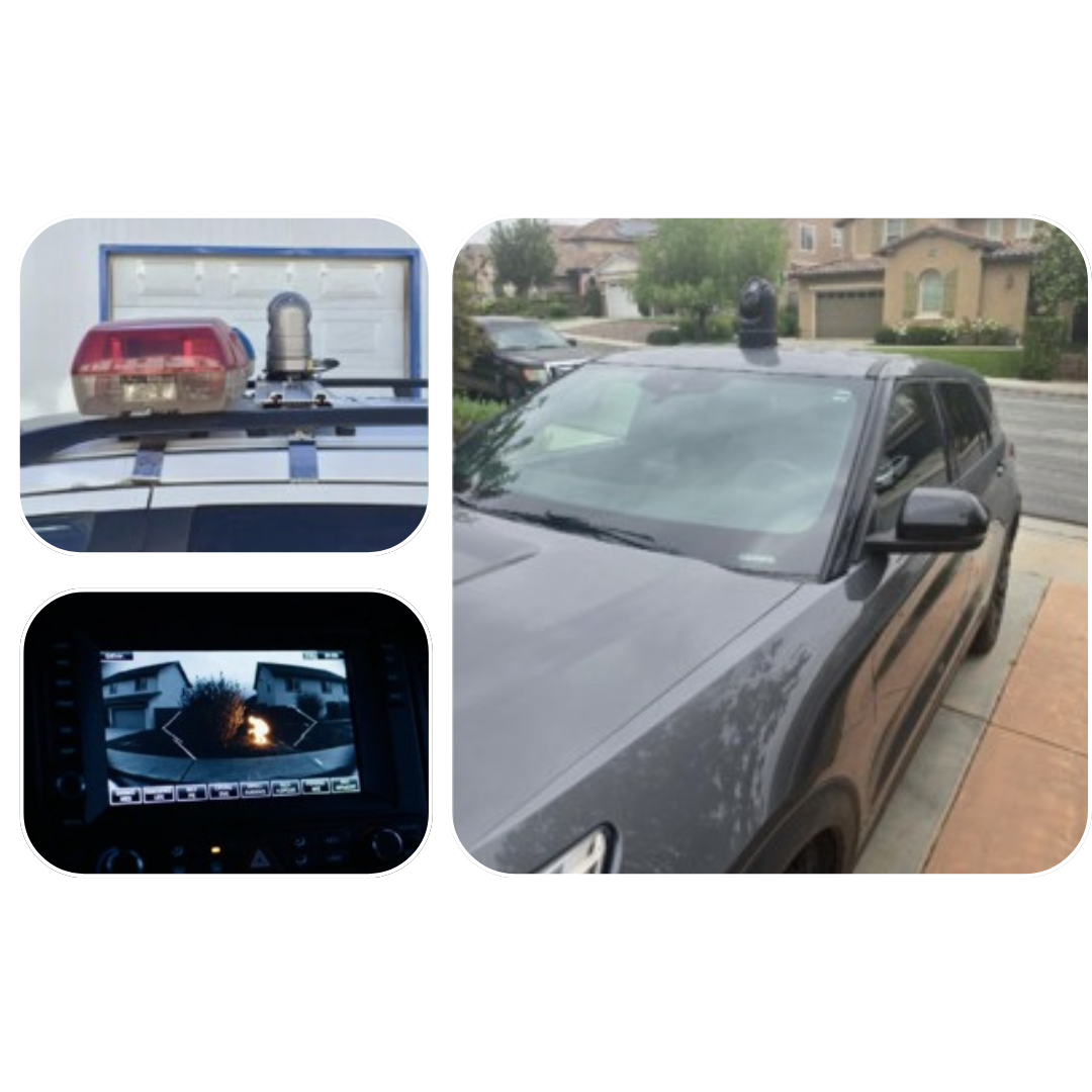 A police vehicle with a camera system on the roof, and a dashboard screen showing a rear view with a fire in the camera’s feed.