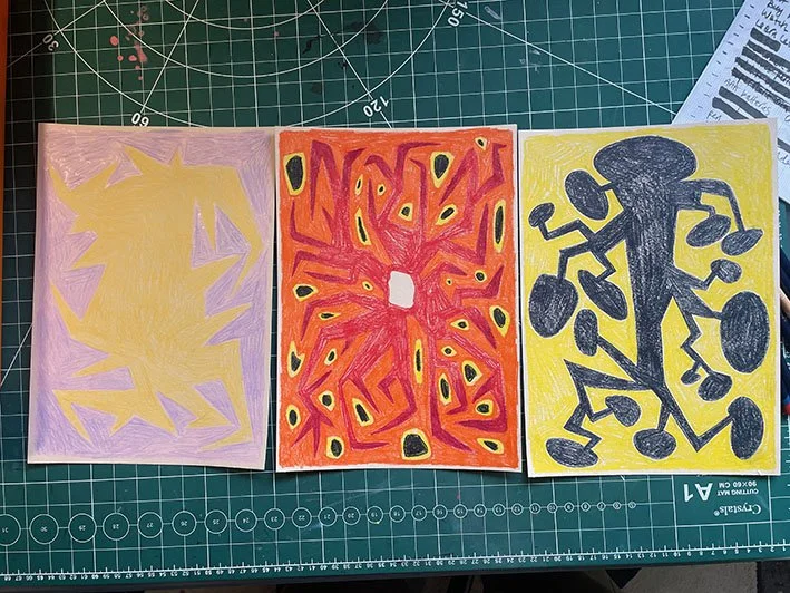 Caran D'ache crayons on coloured paper.