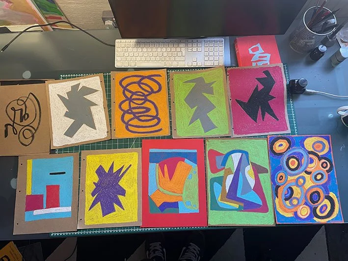 Caran D'ache crayons on coloured paper.