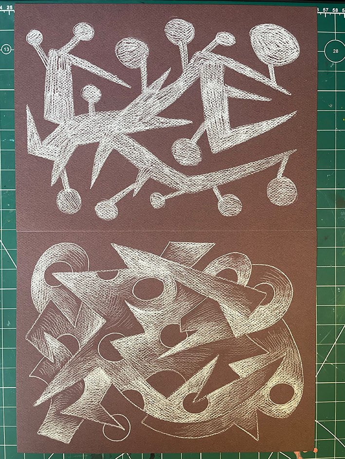 White pencil on dark brown paper.