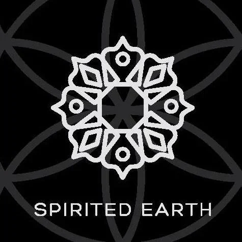 A black background with a white geometric snowflake design and the words "SPIRITED EARTH" below it.