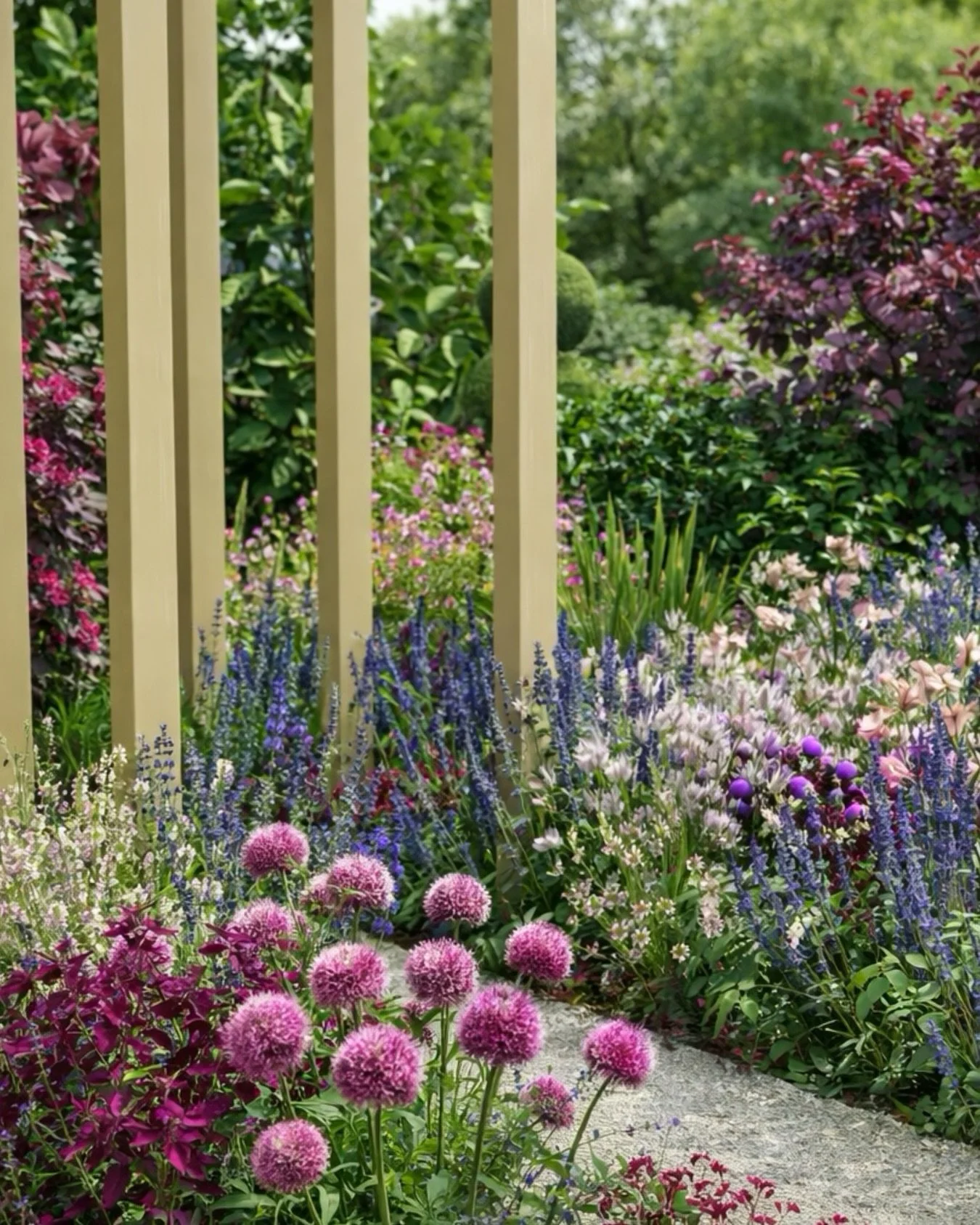 Pergola archways framed by layered planting and soft summer colour. 🌿

Creating moments of structure, enclosure, and movement through the garden.