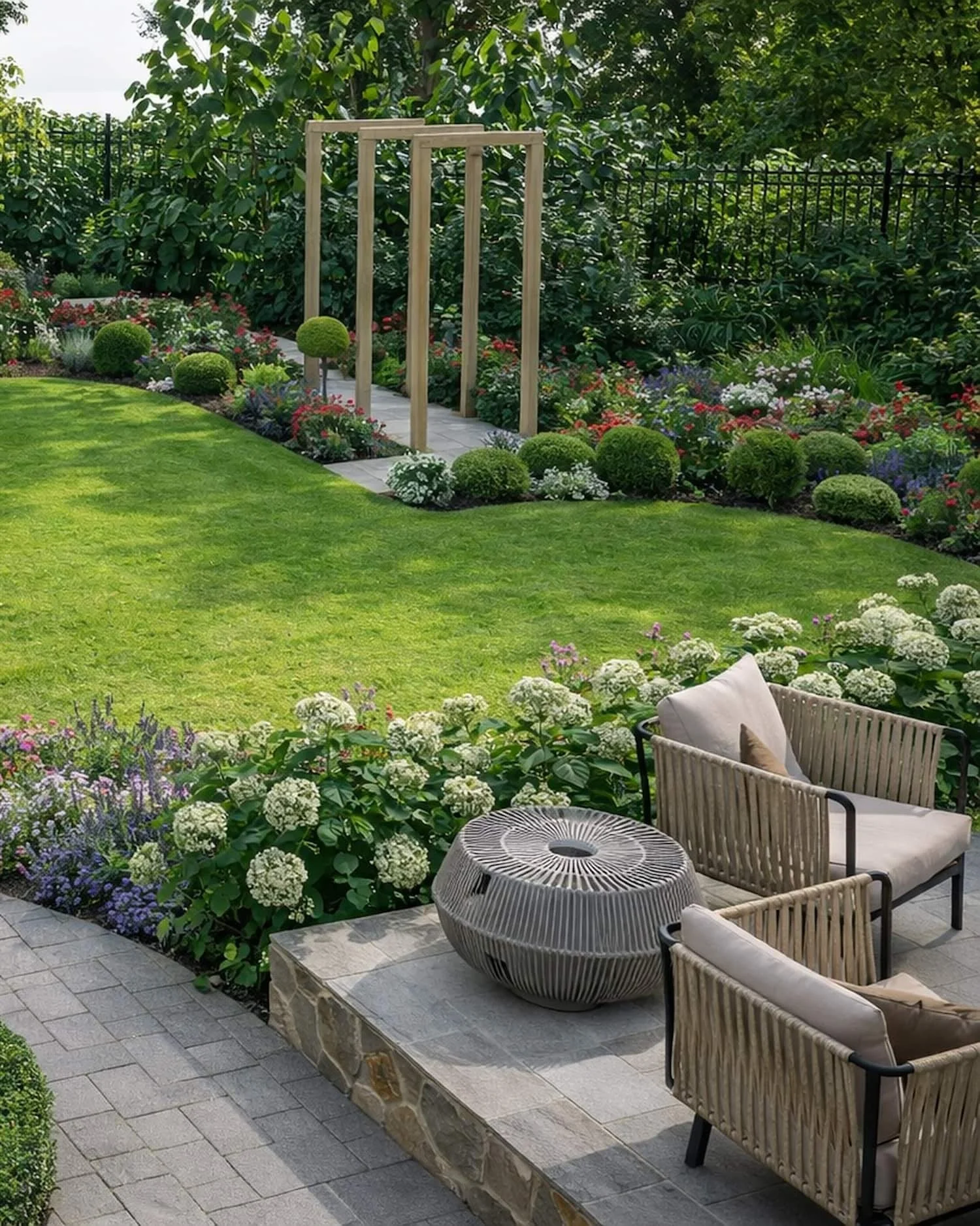 CAD render of a country style garden design with curved planting beds and formal planting. wooden archways. seating on paved area