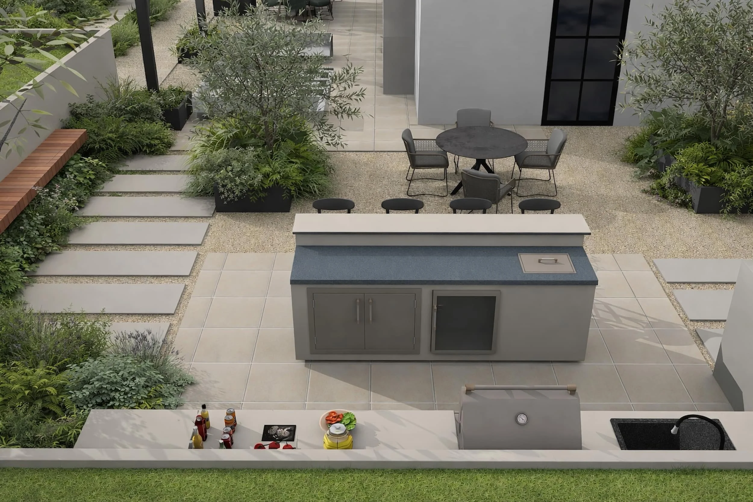 Modern garden design with outdoor kitchen, paved entertaining terrace, gravel pathways and structured planting, creating a practical and elegant space for dining and socialising.