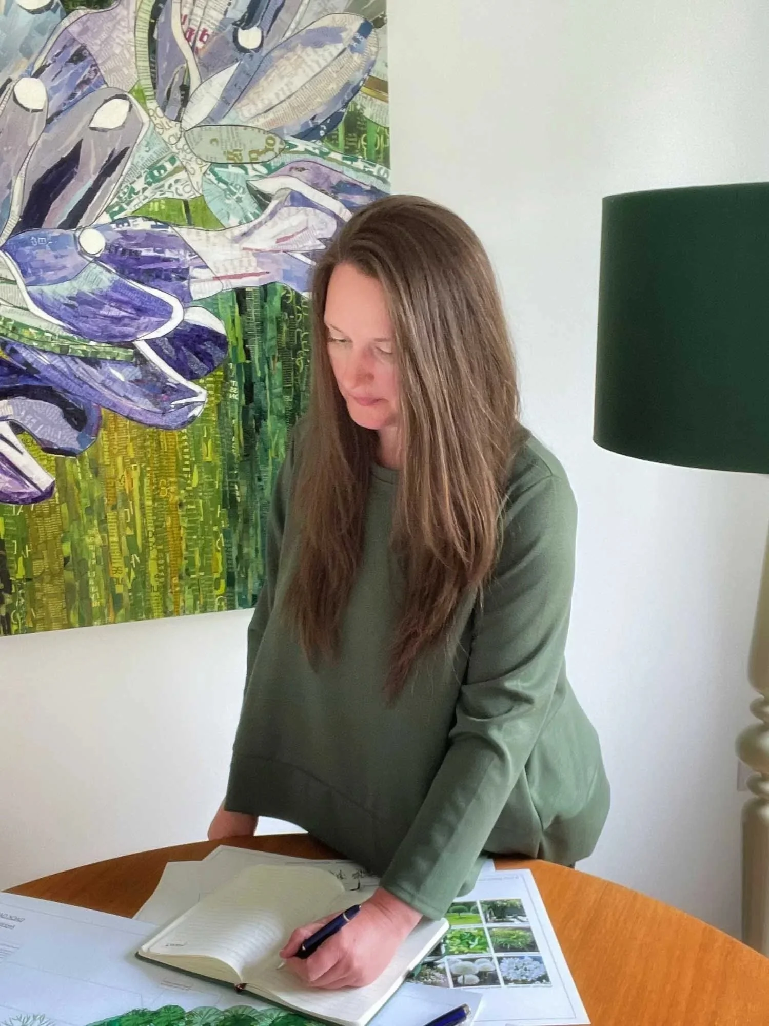 Carly Tong Garden Designer making notes on a design