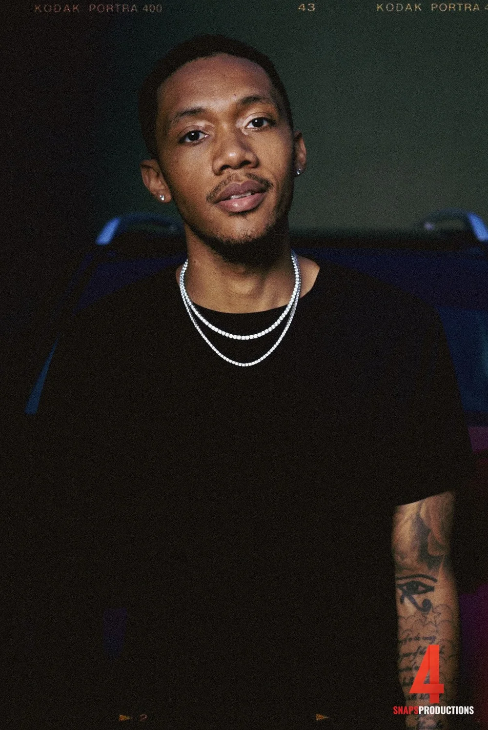 Studio portrait of a man in a black t-shirt photographed by 4 Snaps Productions in Cincinnati