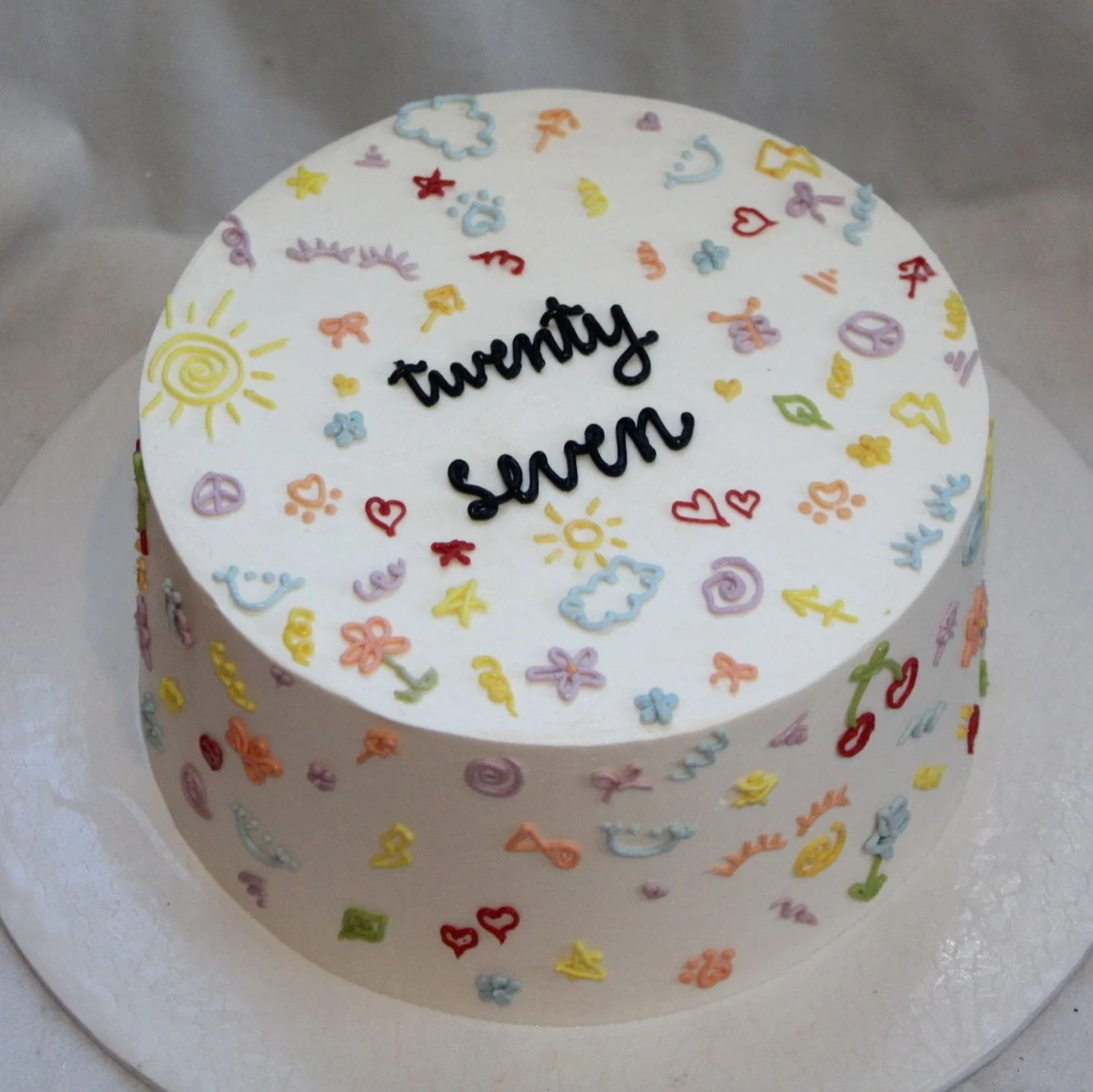 doodle cake !🎨〰️ 

Special request to include eye lashes, the saggitarius symbol, and paw prints☺️
She&rsquo;s so fun😍