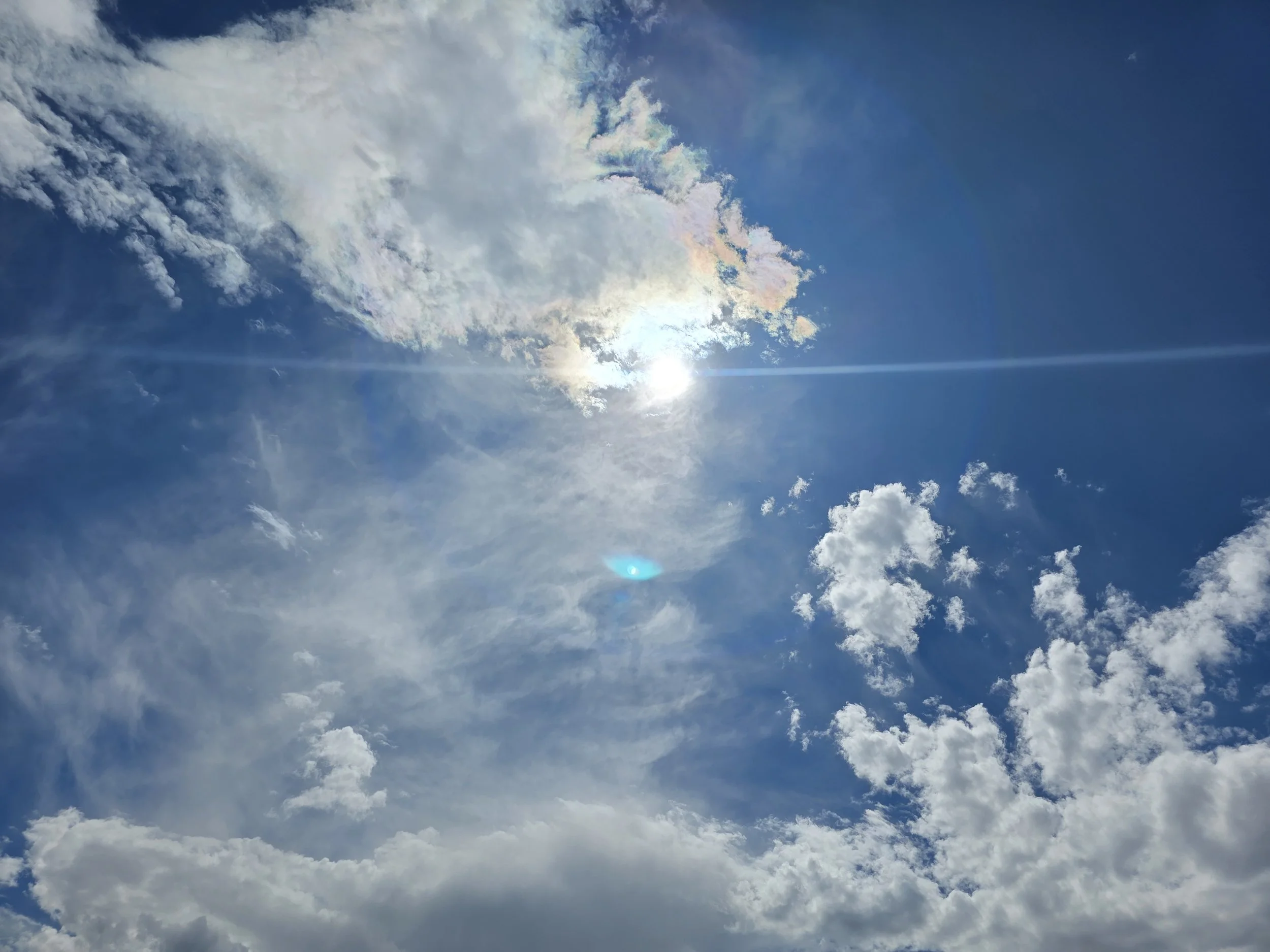 A beautiful, spiritual picture of the Sun and clouds in the sky.