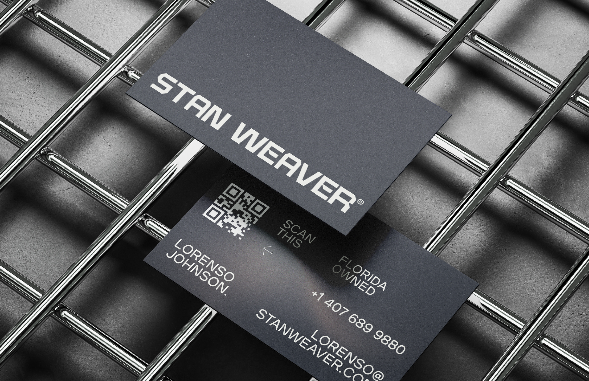 Two business cards with the text "STAY WEAVER" and contact information, placed on a metallic shopping cart.