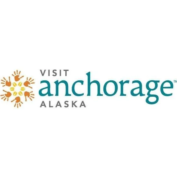 Visit Anchorage Alaska logo with stylized sun and handprints.