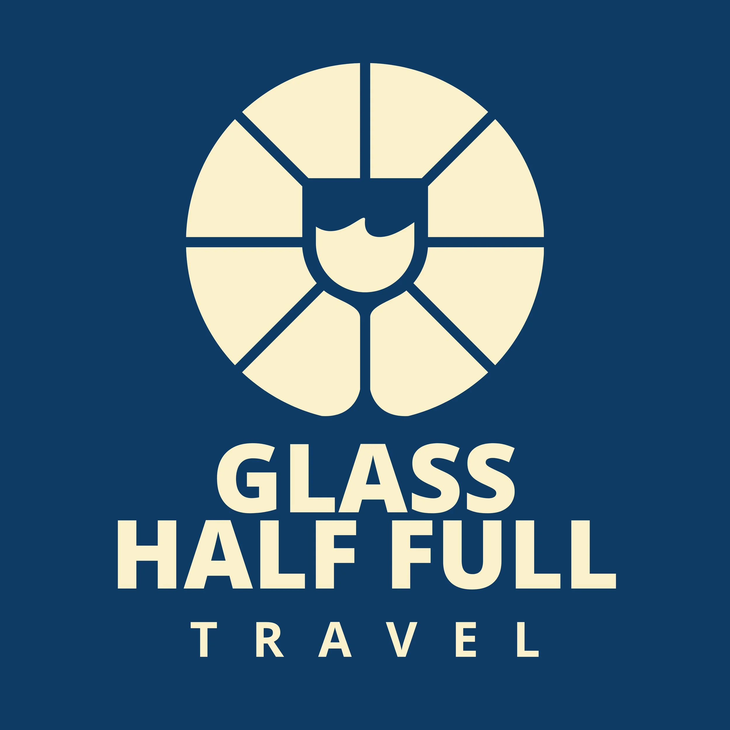 Logo for Glass Half Full Travel featuring a stylized lion's face in a circular frame with the words "GLASS HALF FULL TRAVEL" below.