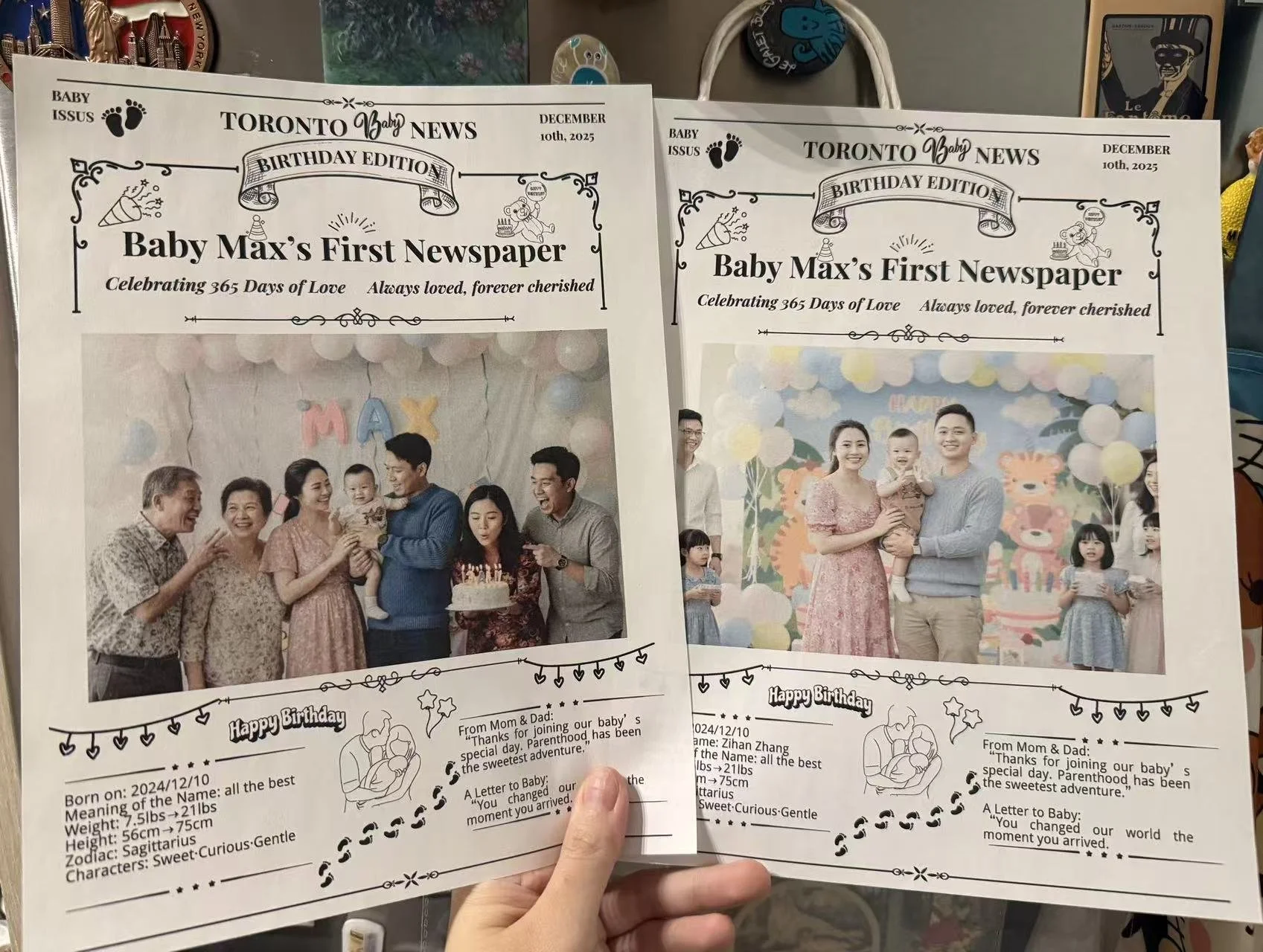 Two birthday-themed newspapers celebrating a baby's first birthday, each featuring a family photo with balloons and birthday decorations. The newspapers include details about the baby's birth date, weight, height, zodiac sign, and a message from parents.