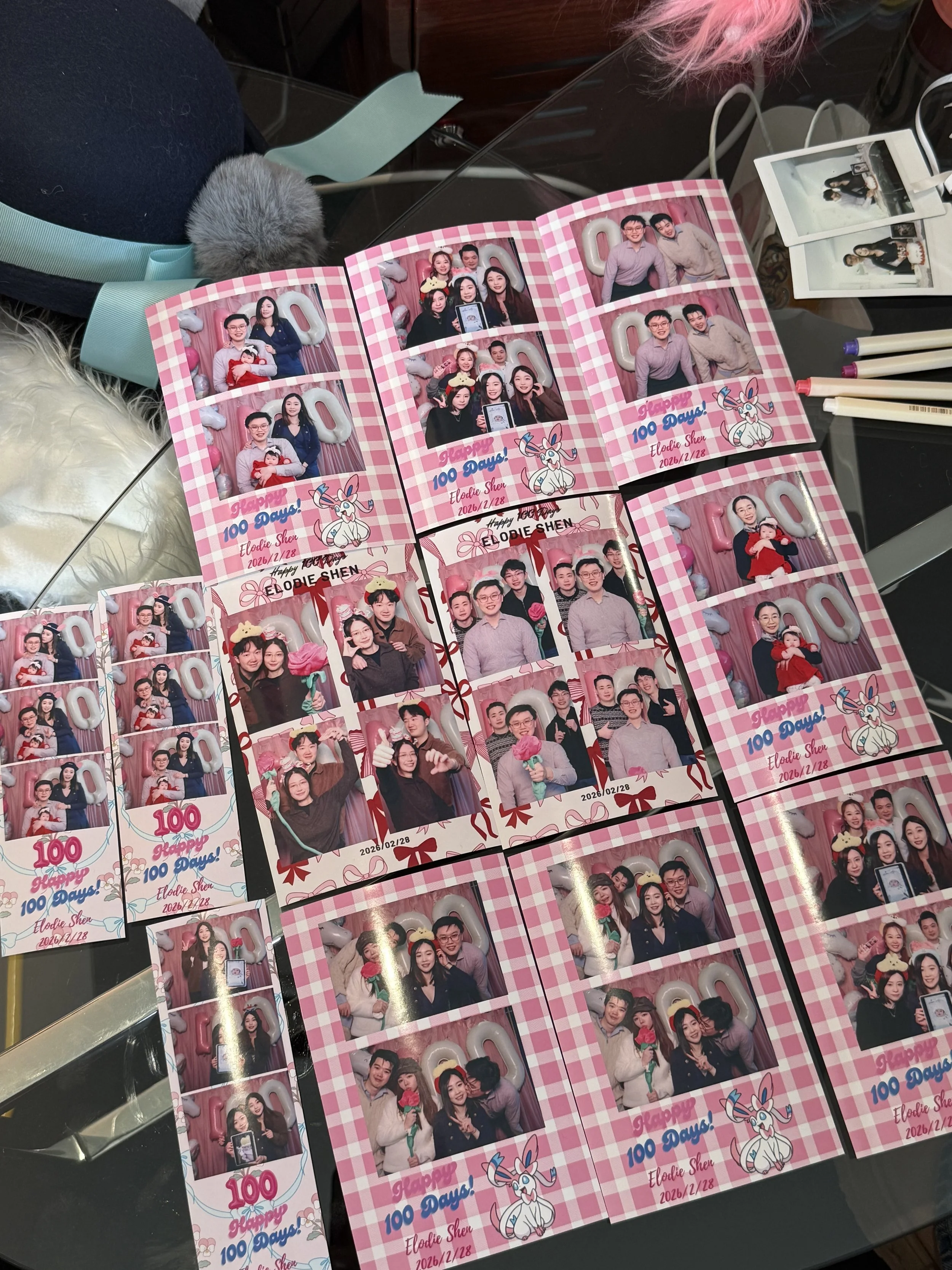 Photo cards with photo booth strips celebrating 100 days for Elodie Shen, with images of people posing, decorated with pink checked backgrounds, bunny illustrations, and the date February 28, 2026.