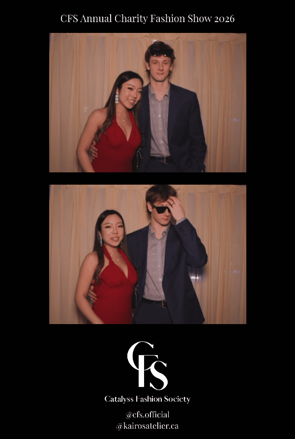 Two young couples at the CFS Annual Charity Fashion Show 2026 posing in front of a beige curtain. The women wear red dresses and the men are in suits, with one man wearing sunglasses.