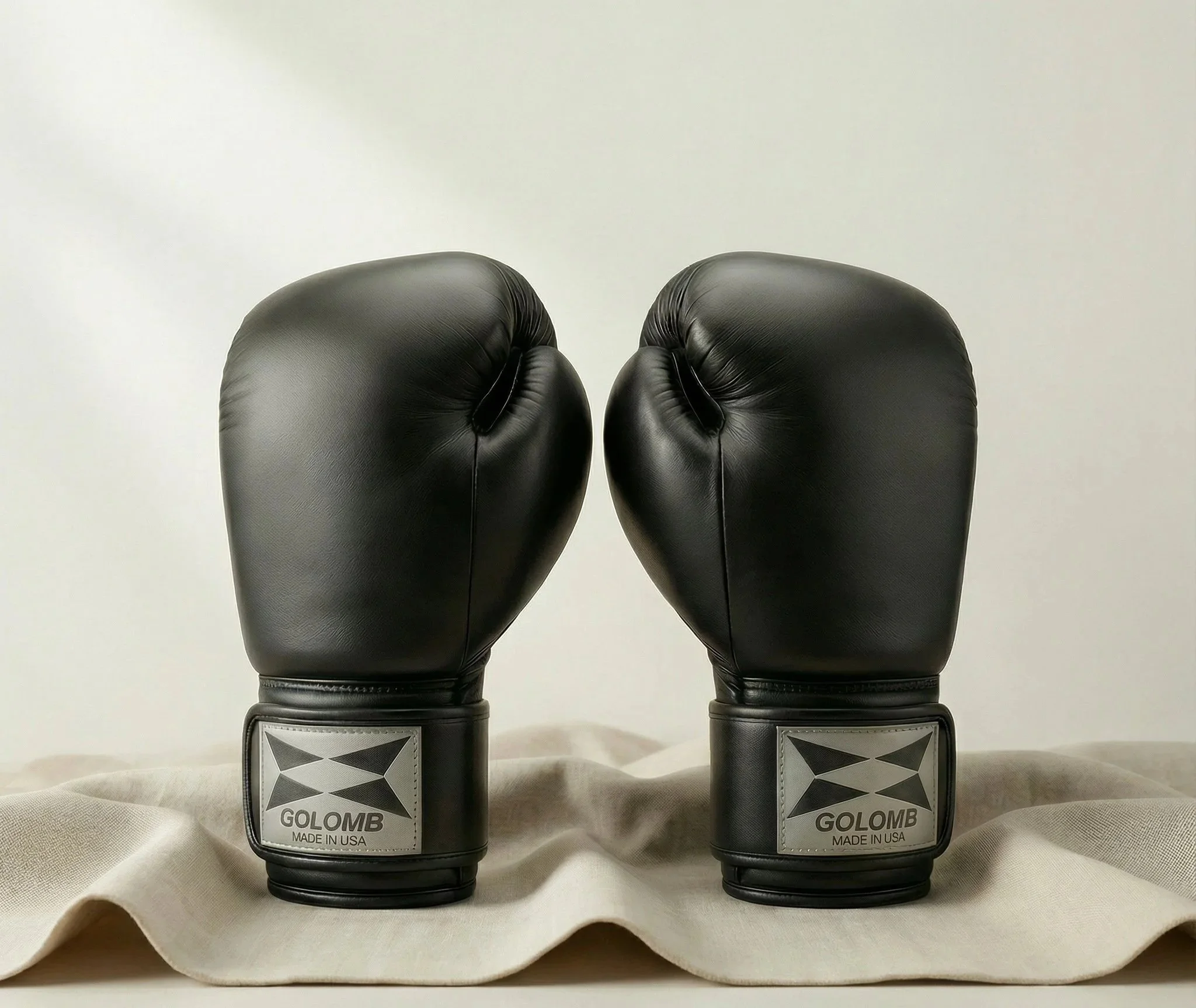 Pair of black GOLOMB boxing gloves