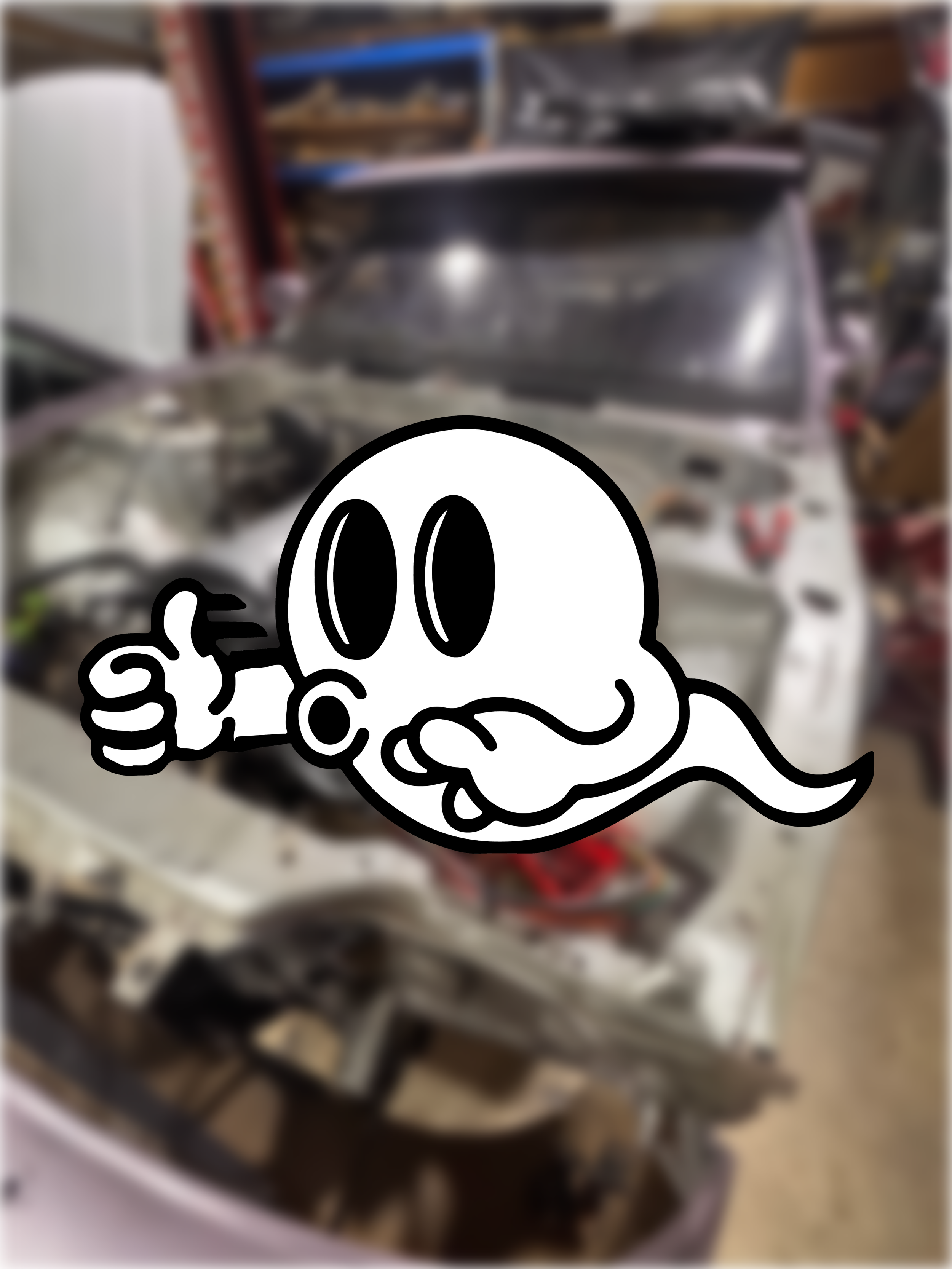 A blurry image of a S13 SILVIA, and a cartoon ghost sticker with a thumbs-up sign in the foreground.