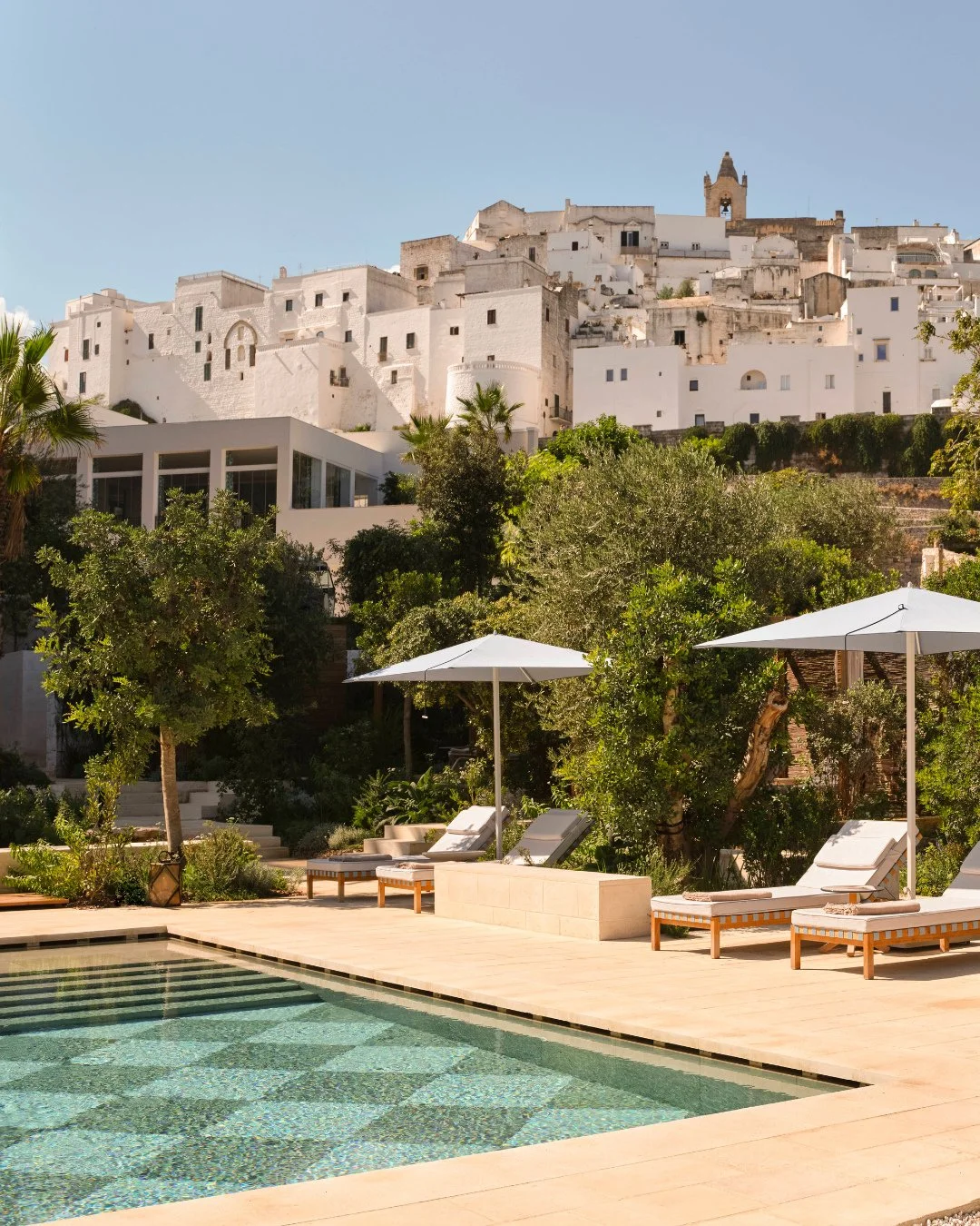 Above the rolling hills of Puglia, @vistaostuni frames every moment in light and elegance. Every stay becomes a timeless escape with sun-soaked terraces and endless views.⁠