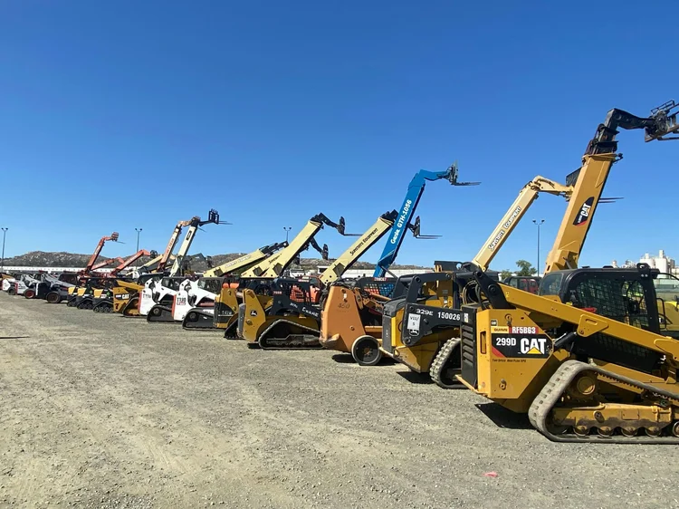 Fleet of heavy equipment staged on a project site