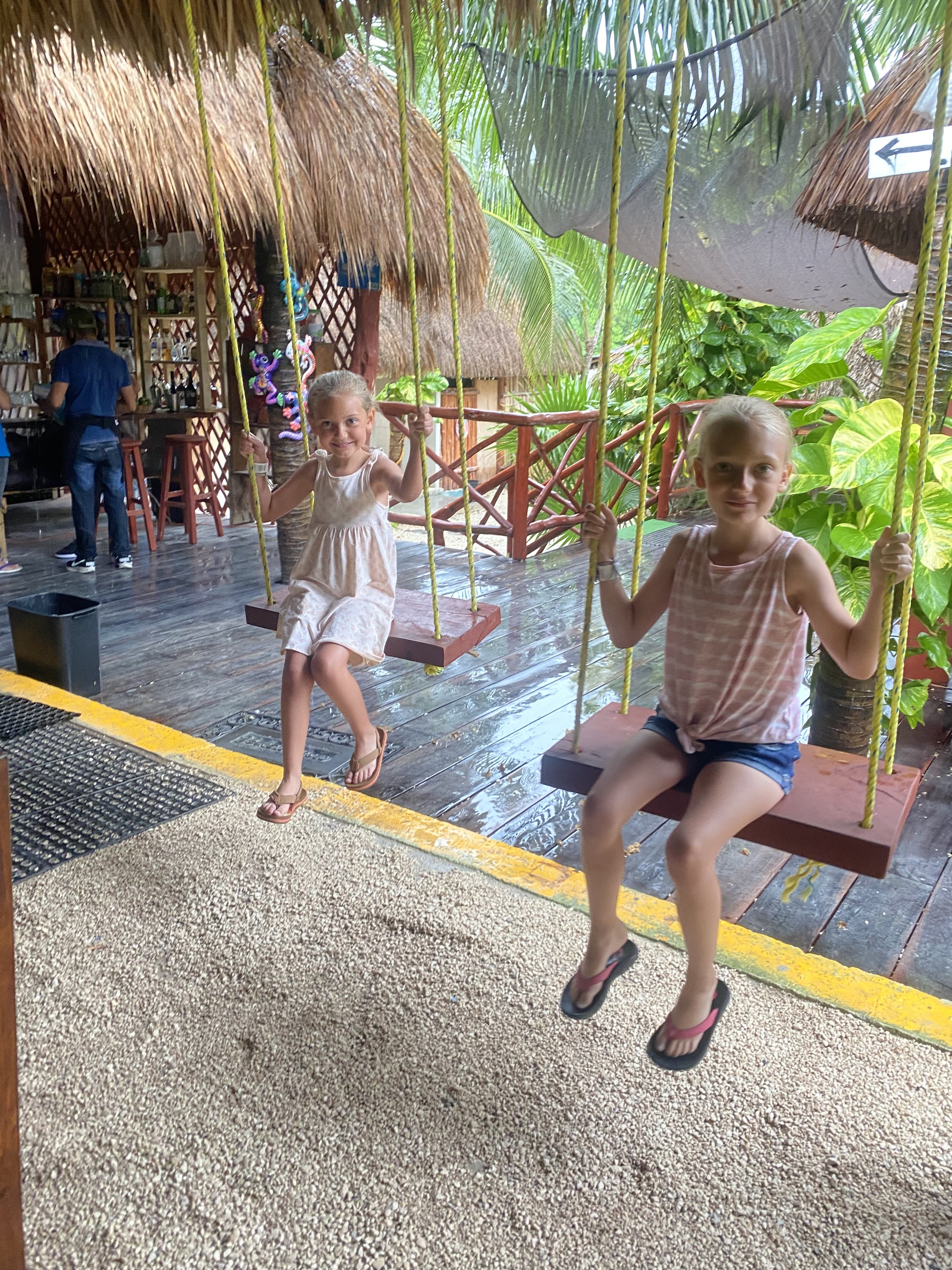 Swinging on swings at the  Dos Ojos Cenote  in Cancun Mexico