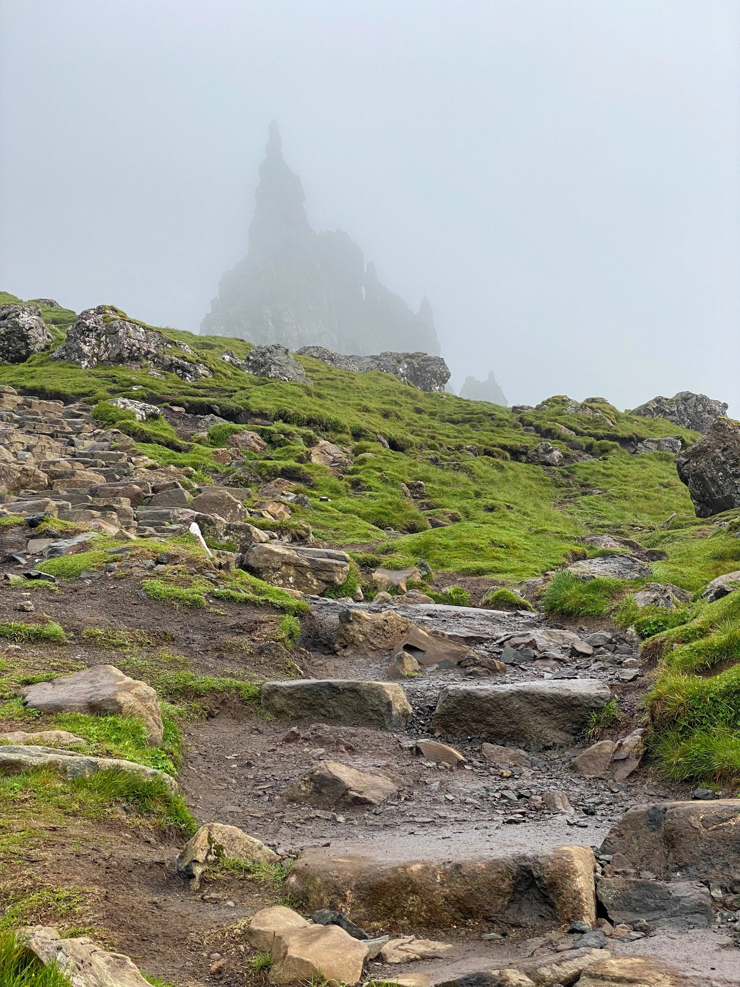 Hiking the Old Man of Storr in the mist on the Isle of Skye in Scotland