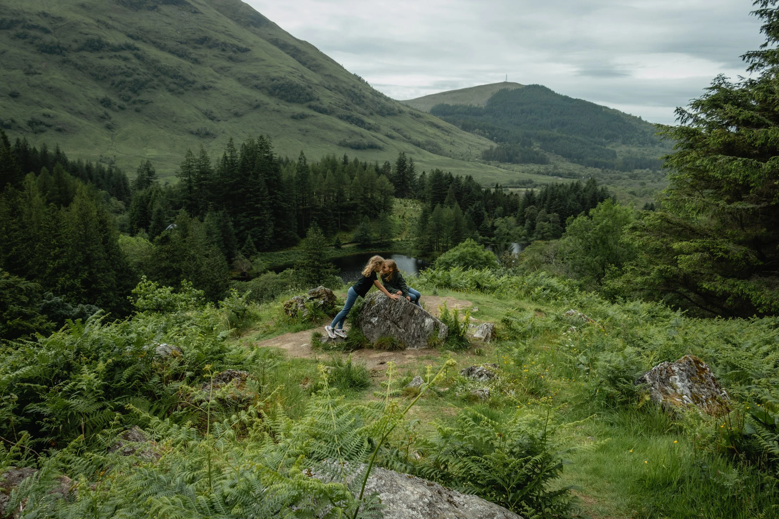 girls playing where Hagrid's Hut once stood in The Harry Potter films in Fort William Scotland