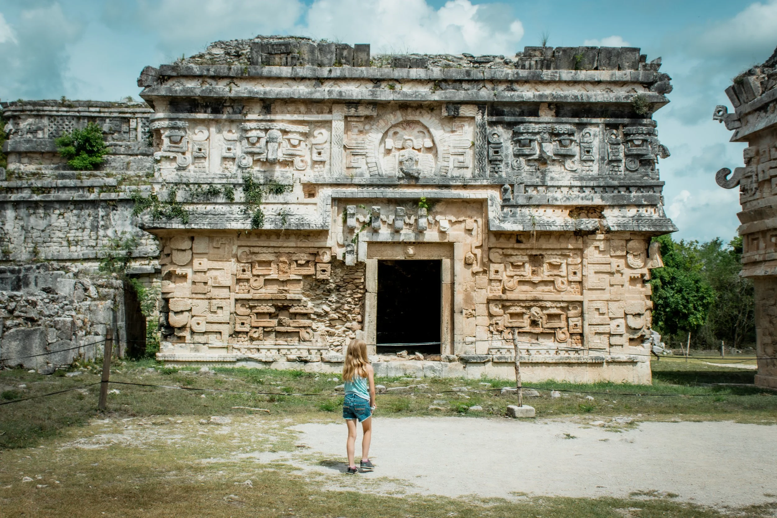 Standing in front of ruins of Chichén Itzá in Mexico
