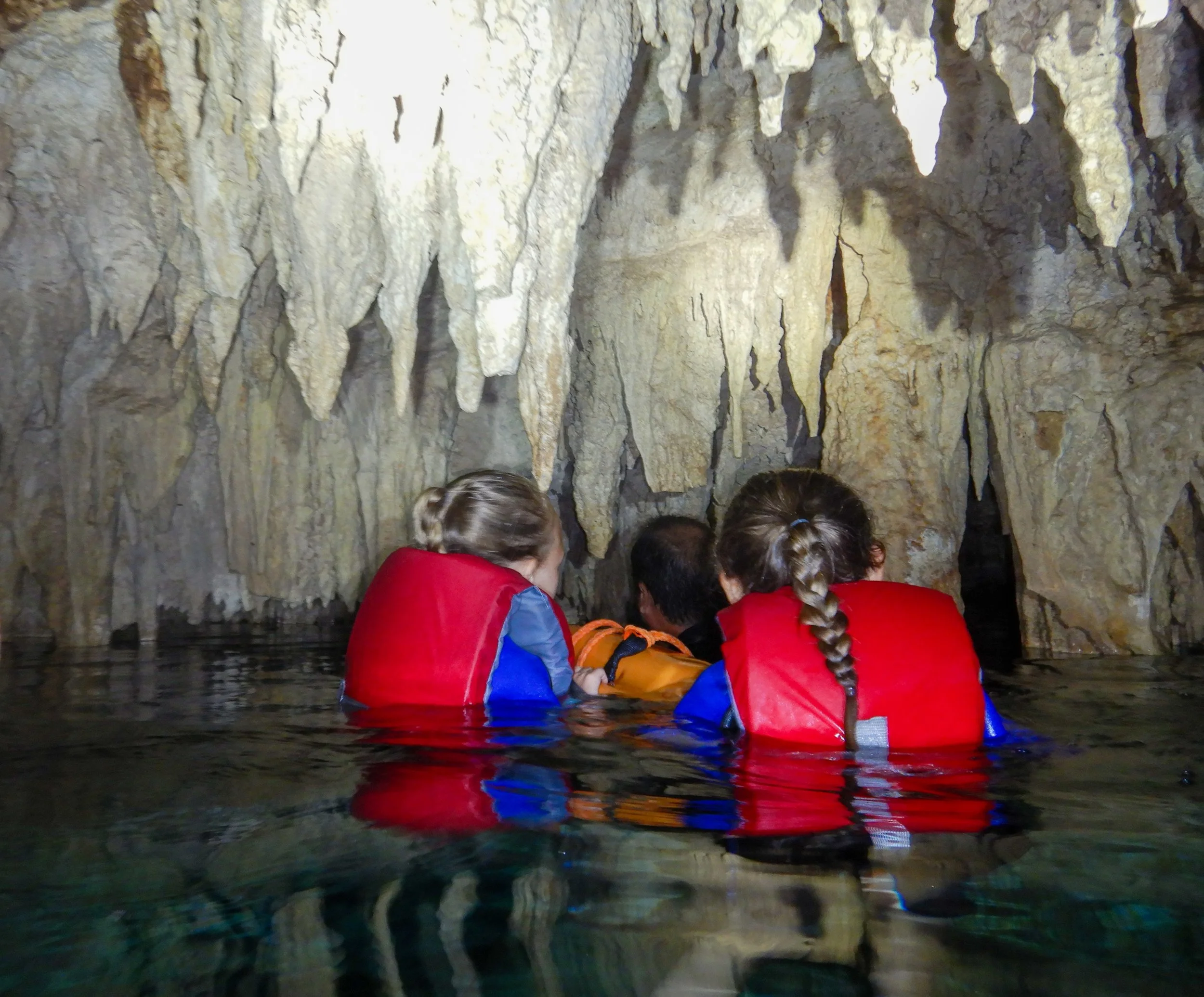 swimming through a bat cave at Dos Ojos Cenote in Cancun Mexicoswimming through a bat cave at Dos Ojos Cenote in Cancun Mexico