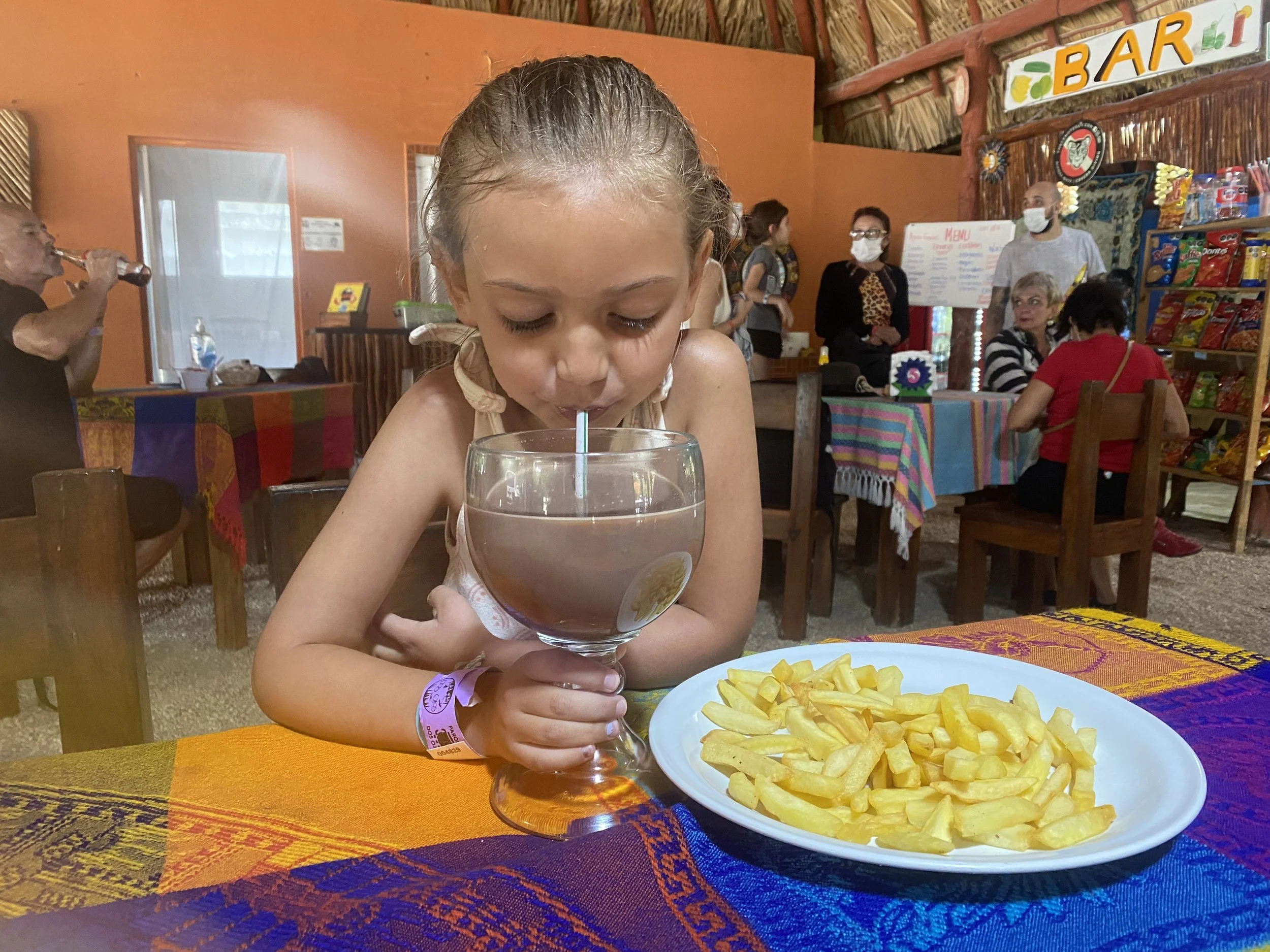 Drinking hot chocolate and eating French fries at  Dos Ojos Cenote  in Cancun Mexico