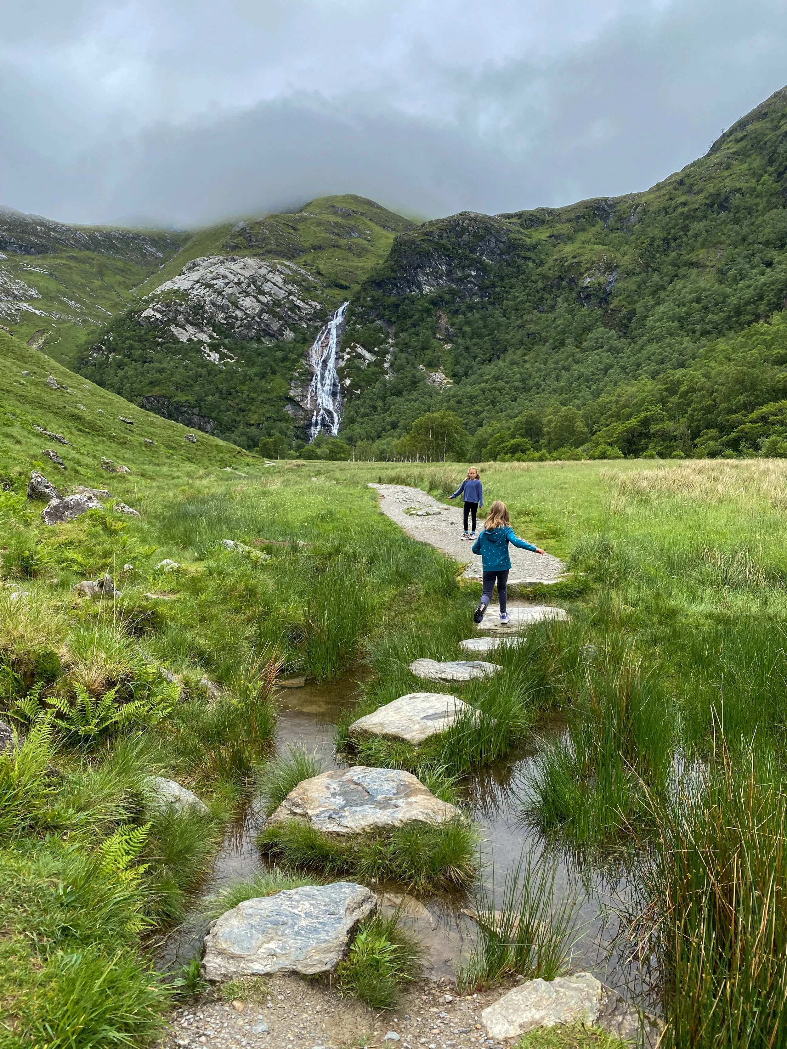 girls hiking to Steall Waterfall, the backdrop if Quidditch games in the Harry Potter films