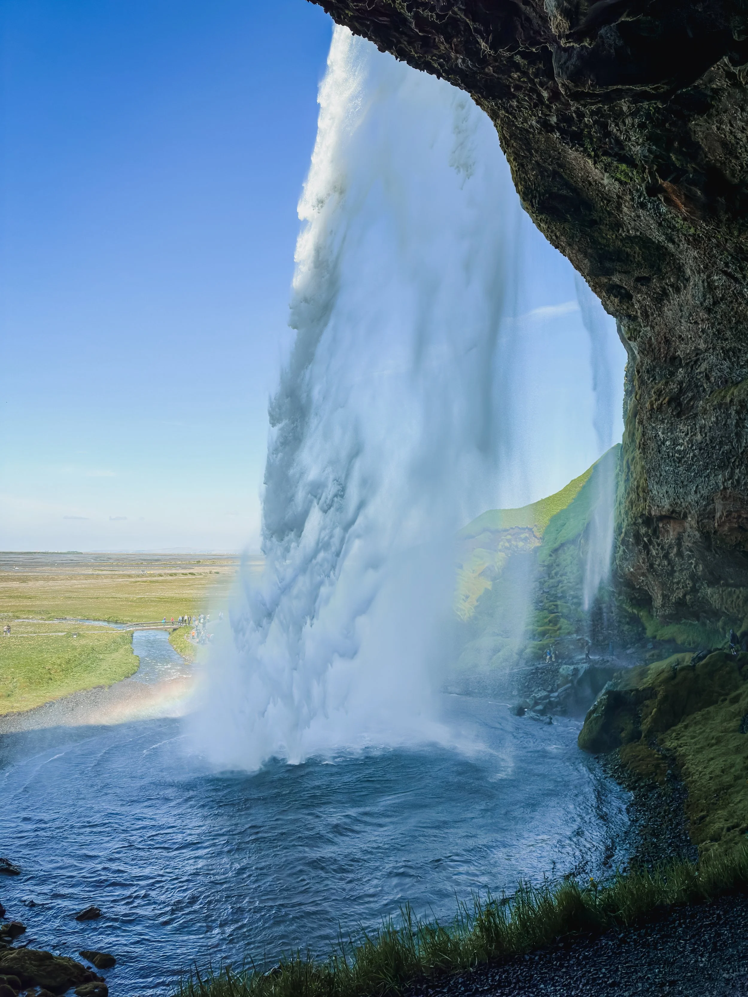 Standing behind Seljalandsfoss in Iceland