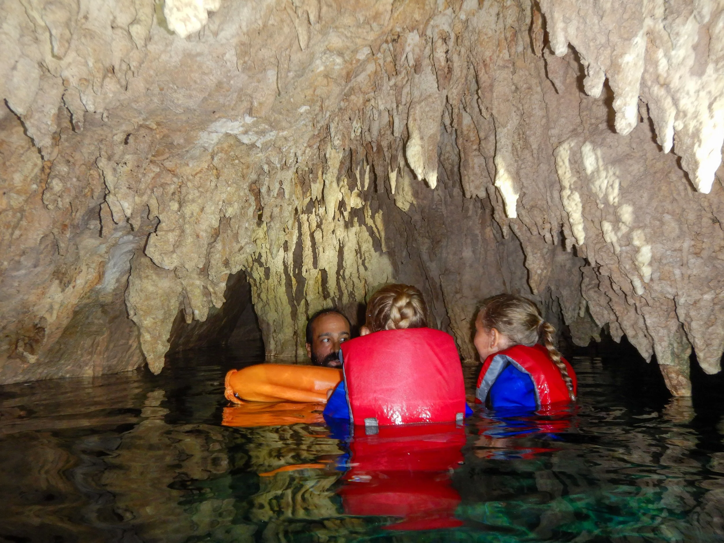 swimming through a bat cave at Dos Ojos Cenote in Cancun Mexicoswimming through a bat cave at Dos Ojos Cenote in Cancun Mexico