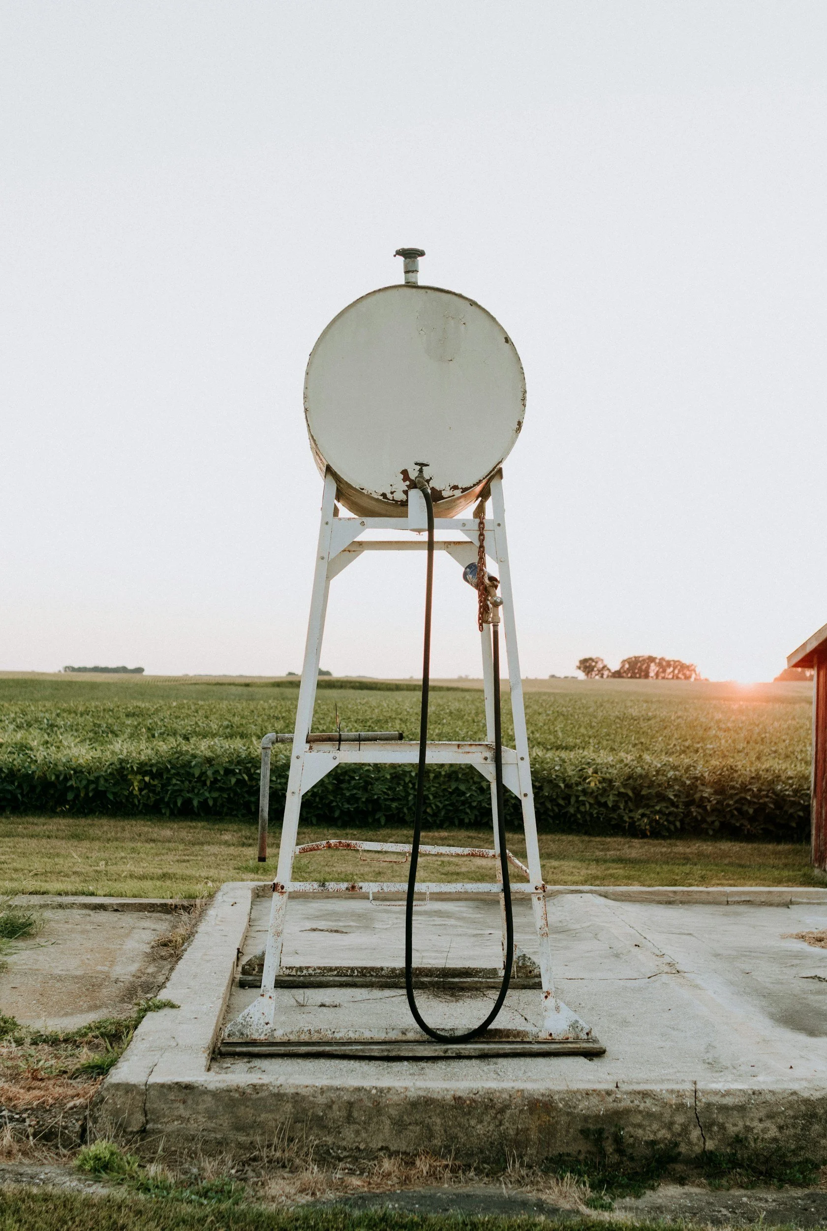 Fuel delivery truck supplying diesel or gasoline to farm or business in rural Oklahoma.