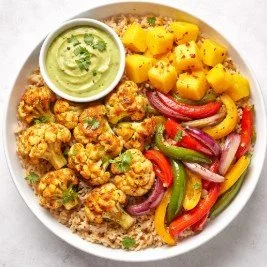 Chili-Lime Roasted Cauliflower and Mango Bowl with Avocado Crema.jpg