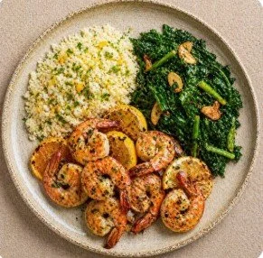 Citrus Garlic Shrimp with cauliflower rice and saute'd greens.jpg