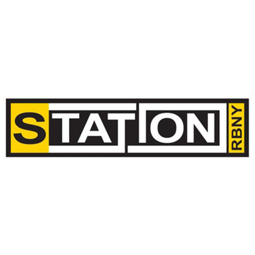 Logo for S TATION RBNY with a black background, yellow and white text, and black borders around the letters.