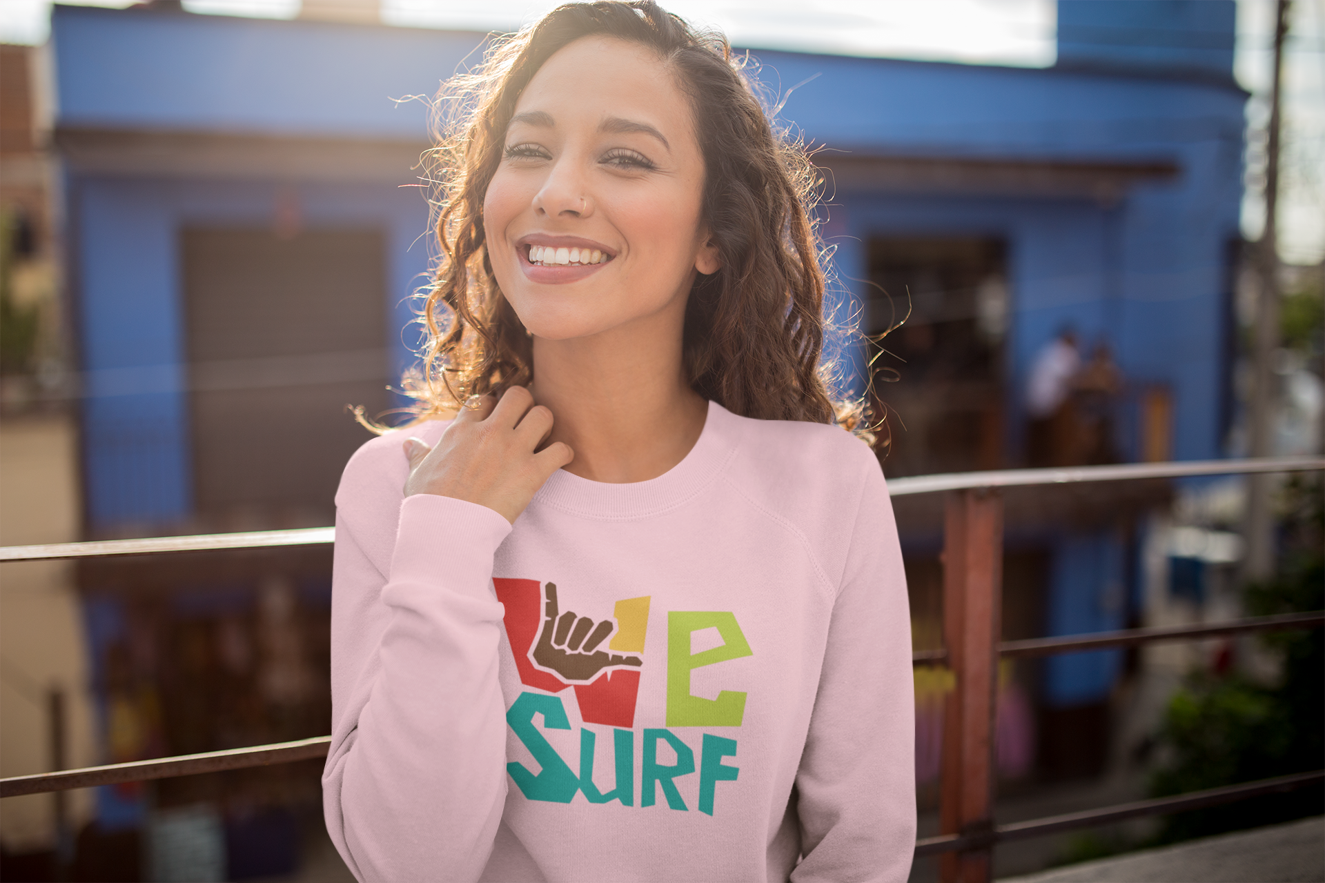 sweatshirt-mockup-of-a-happy-woman-on-a-balcony-22290.png
