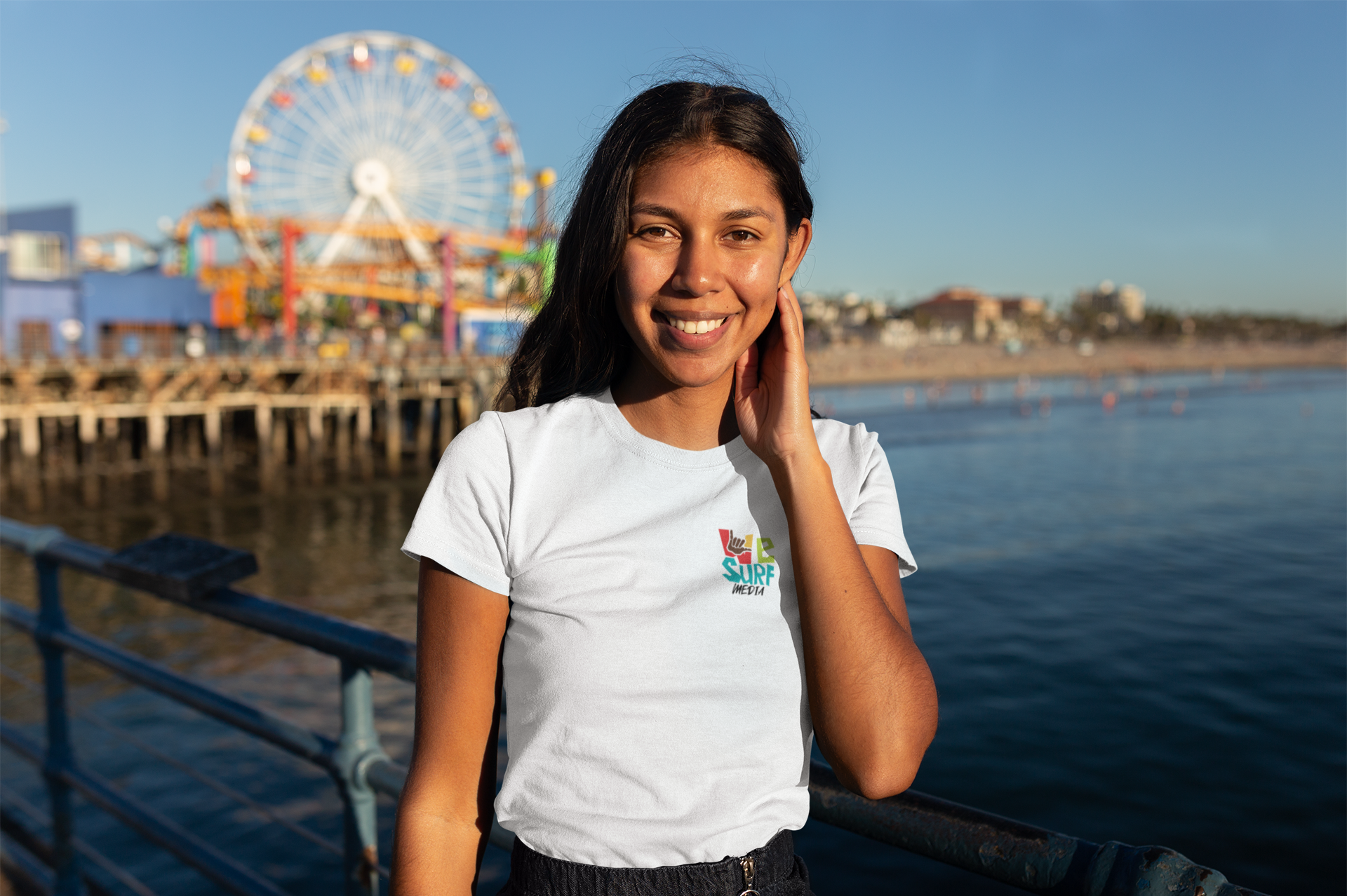 t-shirt-mockup-of-a-woman-on-the-santa-monica-pier-18214.png
