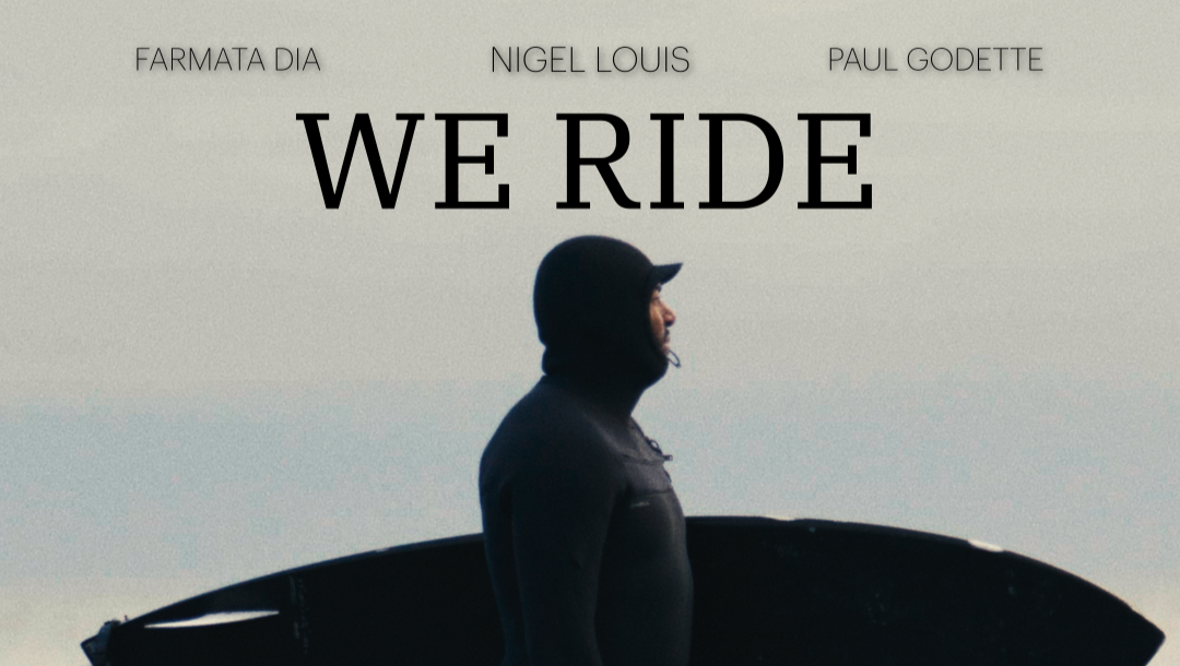 Poster of a person holding a surfboard, wearing a wetsuit and hood, standing in profile against a cloudy sky from We Ride Documentary