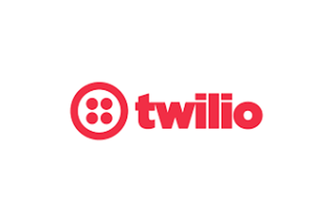Red Twilio logo featuring a circular symbol with four dots and the word 'twilio' in lowercase.