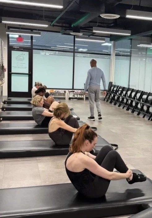 Adama Grace with Chris Robinson in a workshop at the Pilates Loft Columbia Pike, March 2025