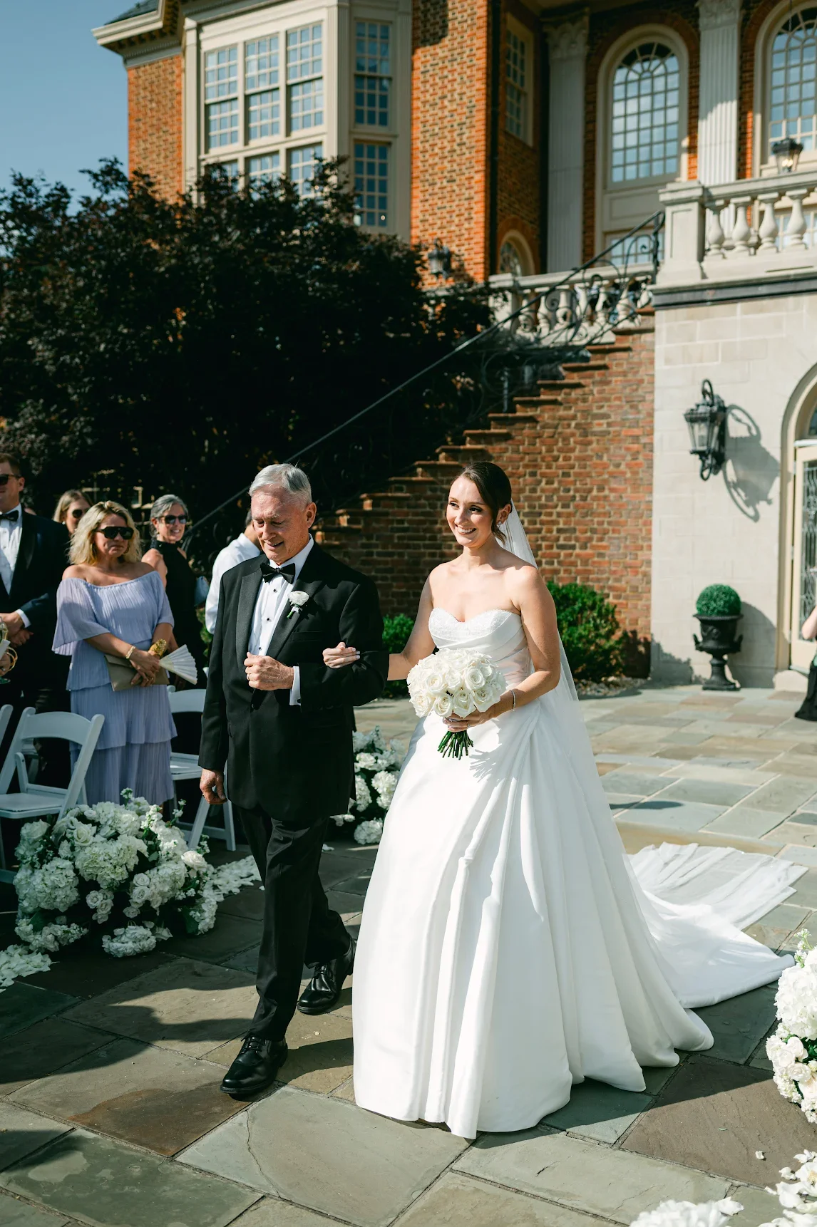 father of the bride walking down the aisle.webp