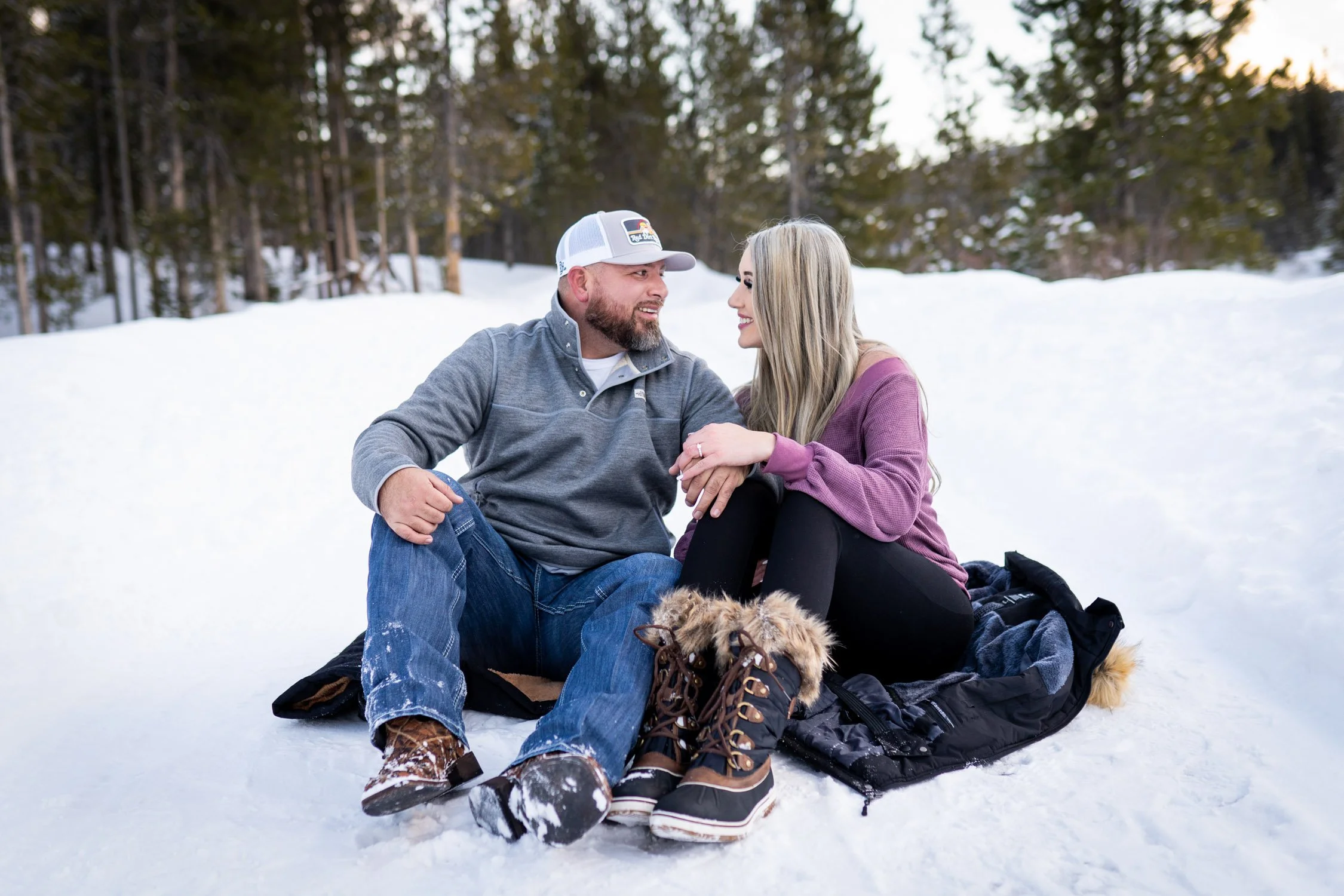 couple-sitting-on-snow-romantic.jpg