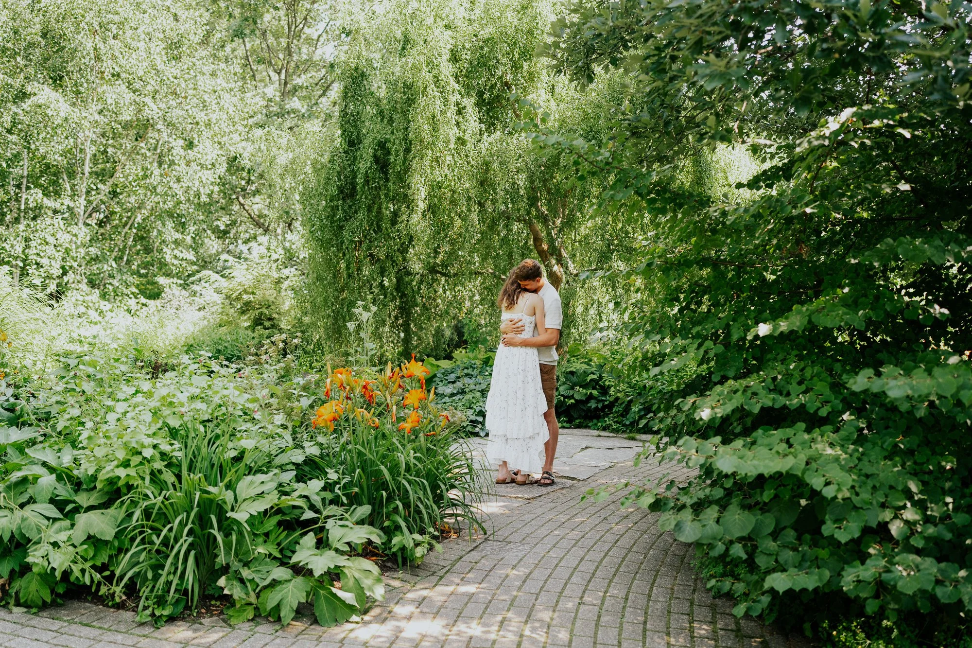 Newly engaged couple hugging at gardens in Madison WI