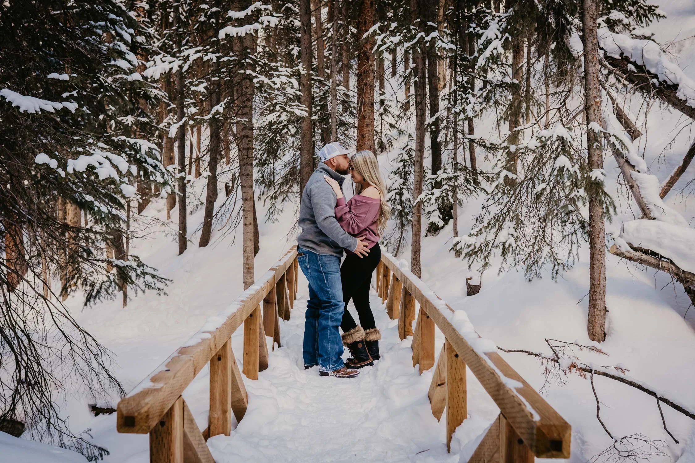 forehead-kiss-on-small-bridge-on-trail.jpg