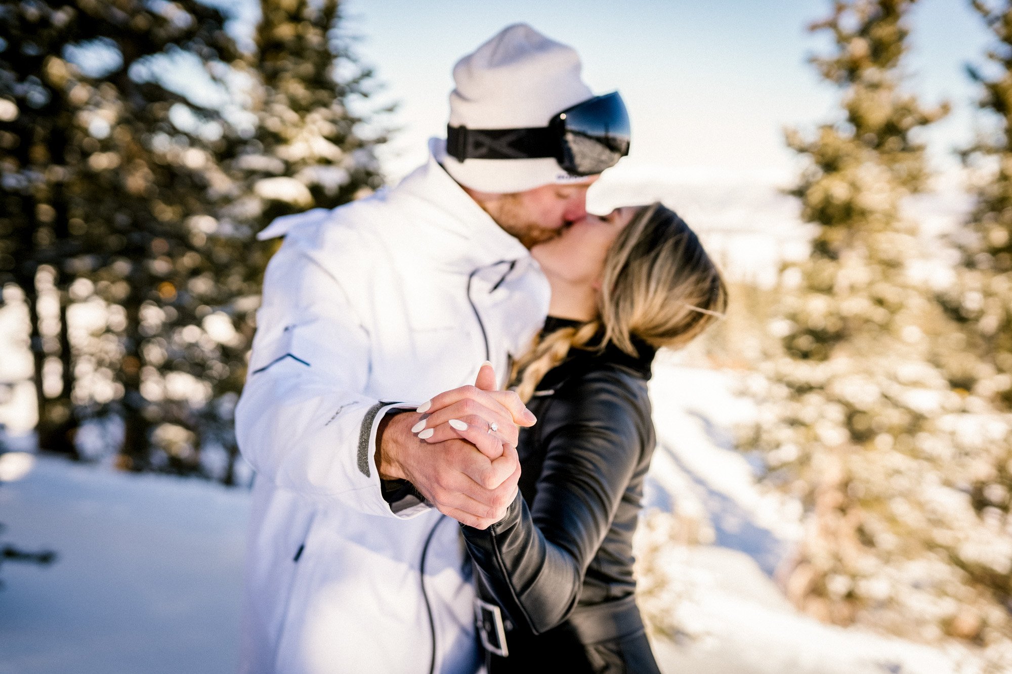 daimond-ring-kissing-photo-while-skiing.jpg